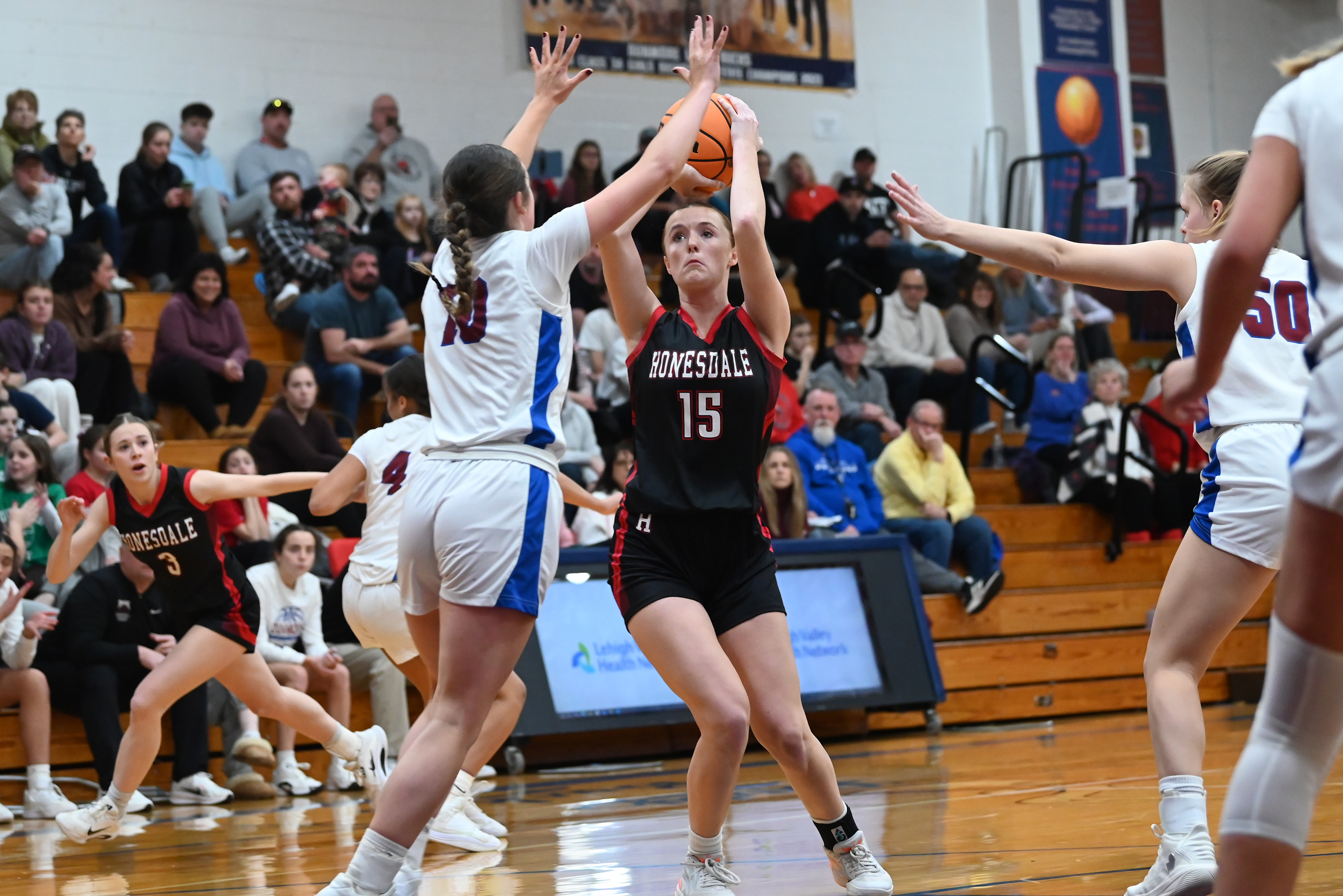 Honesdale’s Ruby Martin takes a shot during the basketball game...