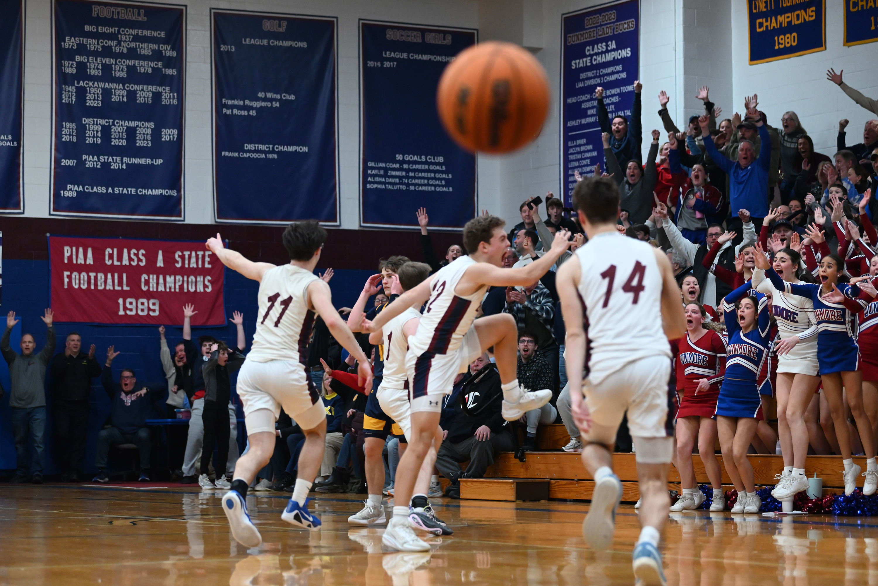 Players and fans celebrate after Dunmore’s Brayden Canavan made a...
