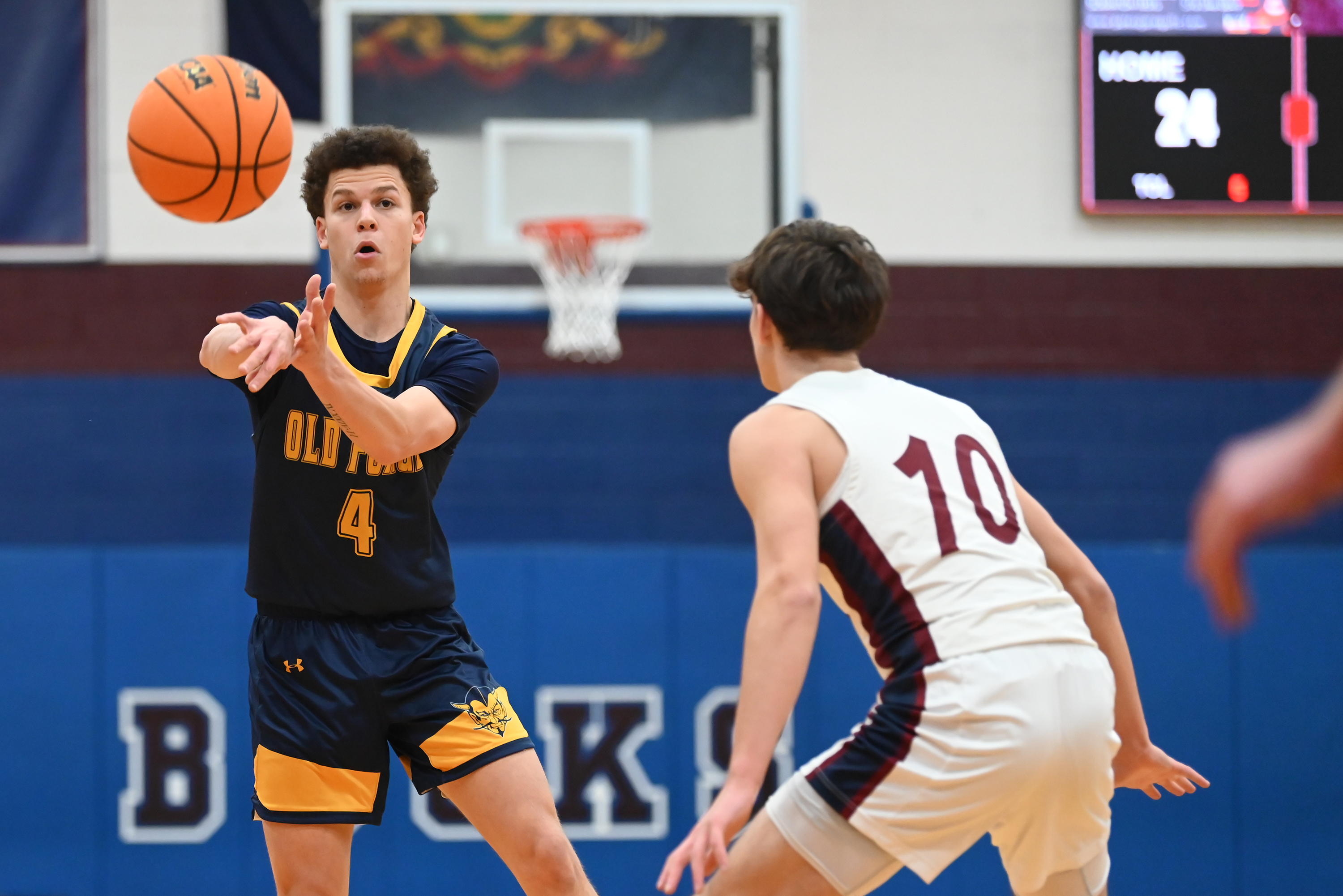 Old Forge’s Cameron Parker passes the ball during the basketball...