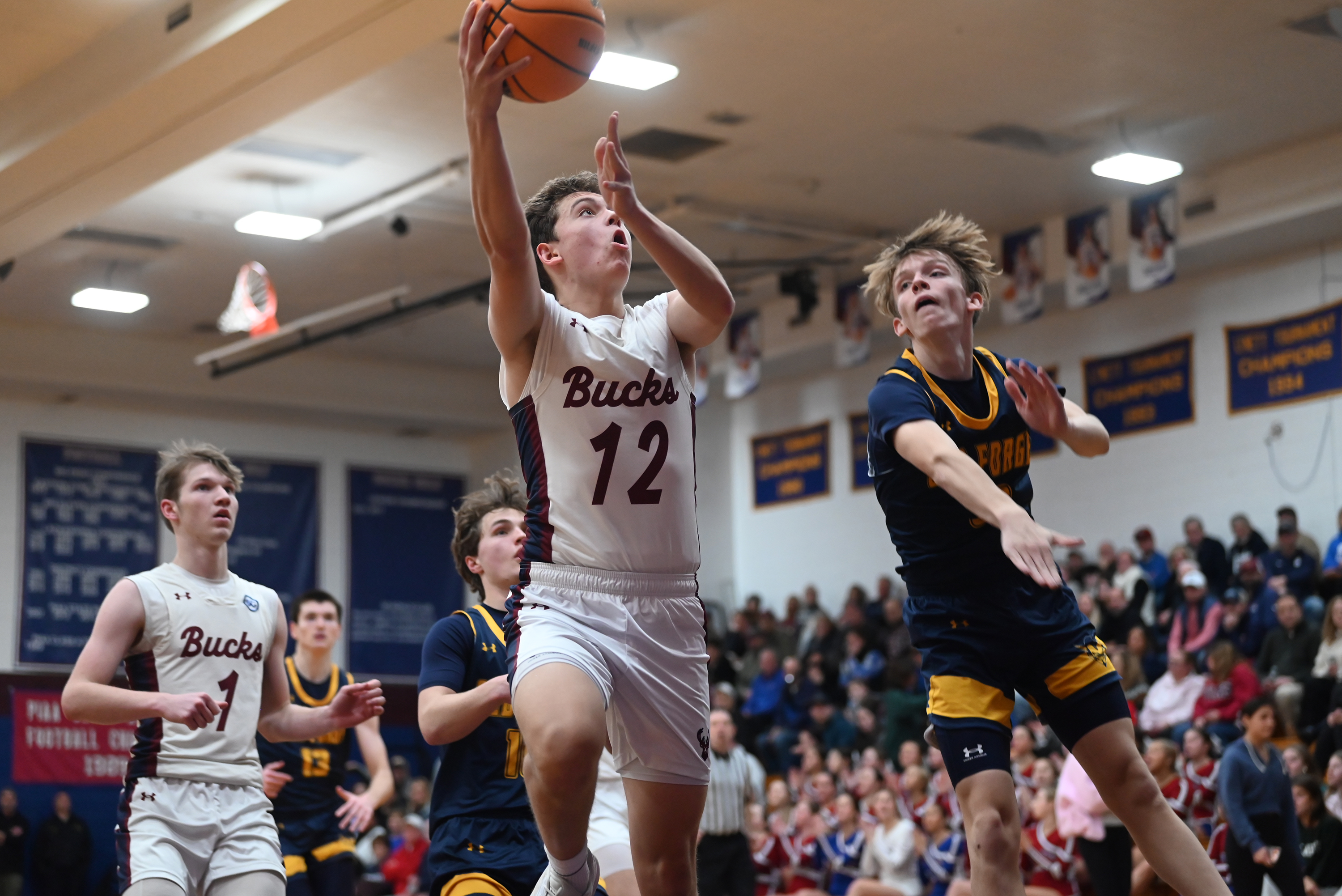 Dunmore’s Jimmy Clark takes a shot during the basketball game...