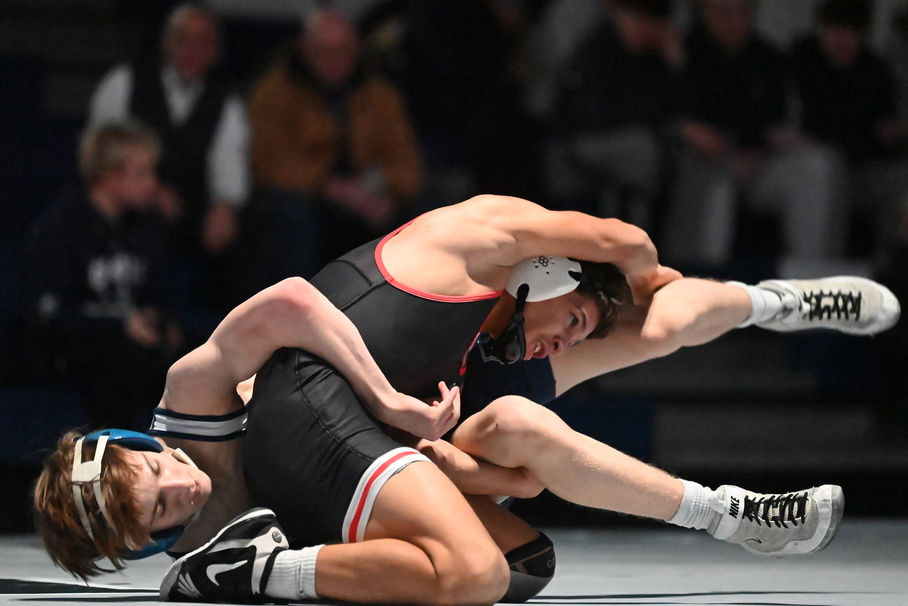 Delaware Valley’s Zion Colon, right, wrestles Abington Heights’ Lucas Kareha...