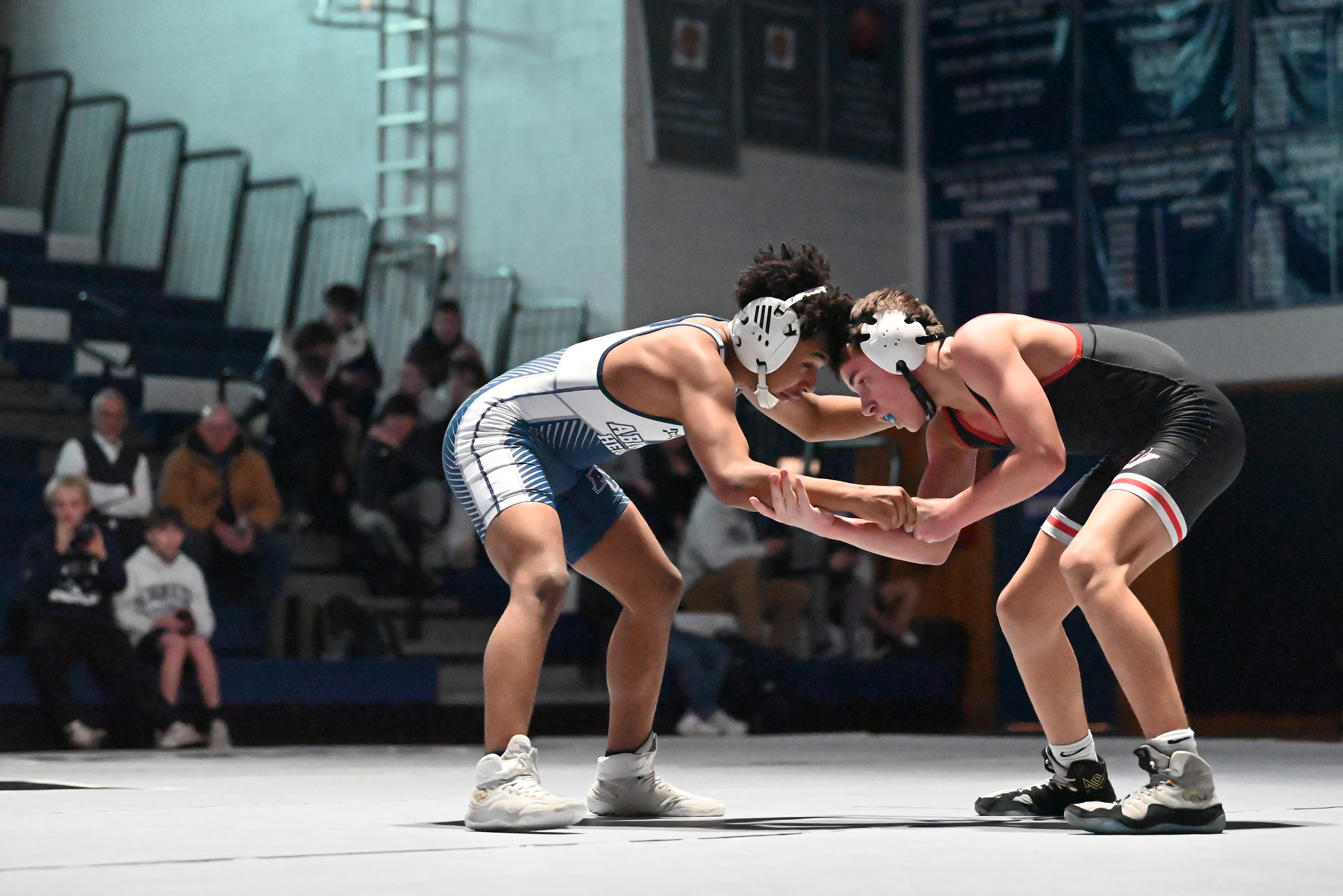 Abington Heights’ Justin Baret, left, wrestles Delaware Valley’s Angelo Cosentino...