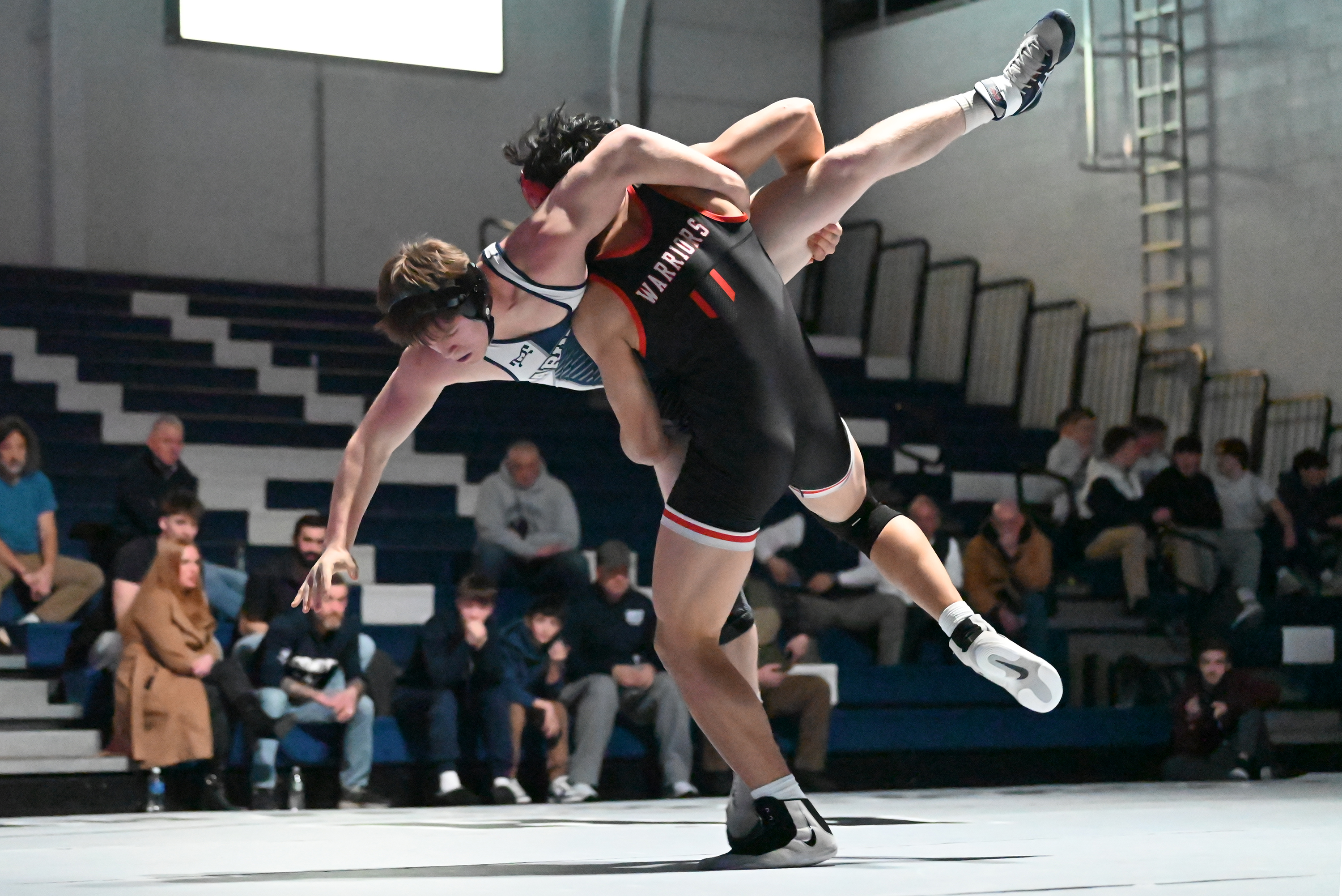 Delaware Valley’s Jeremiah Segal, front, wrestles Abington Heights’ Zack Brower...