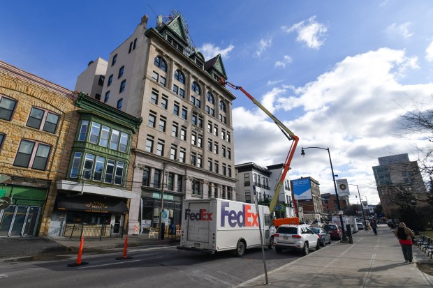 Crew members work on a crane at the Fidelity Bank building in Scranton Friday, January 16, 2026. (SEAN MCKEAG / STAFF PHOTOGRAPHER)
