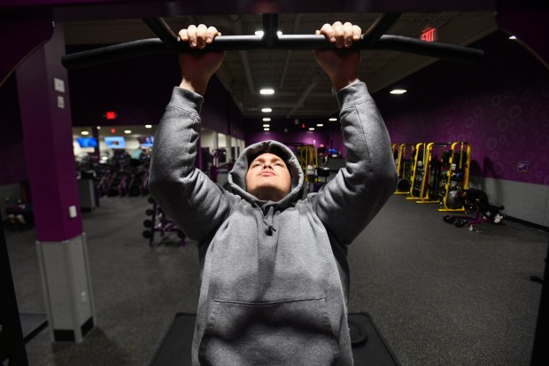 Jonah Bariss, of Northfield N.J., does pull-ups at the Planet Fitness in Taylor Thursday, January 29, 2026. (SEAN MCKEAG / STAFF PHOTOGRAPHER)