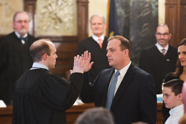 Lackawanna County District Attorney Brian Gallagher, right, is sworn in by Judge Sean Gallagher in Courtroom 3 in the Lackawanna County Courthouse in Scranton Monday, January 5, 2025. (SEAN MCKEAG / STAFF PHOTOGRAPHER)