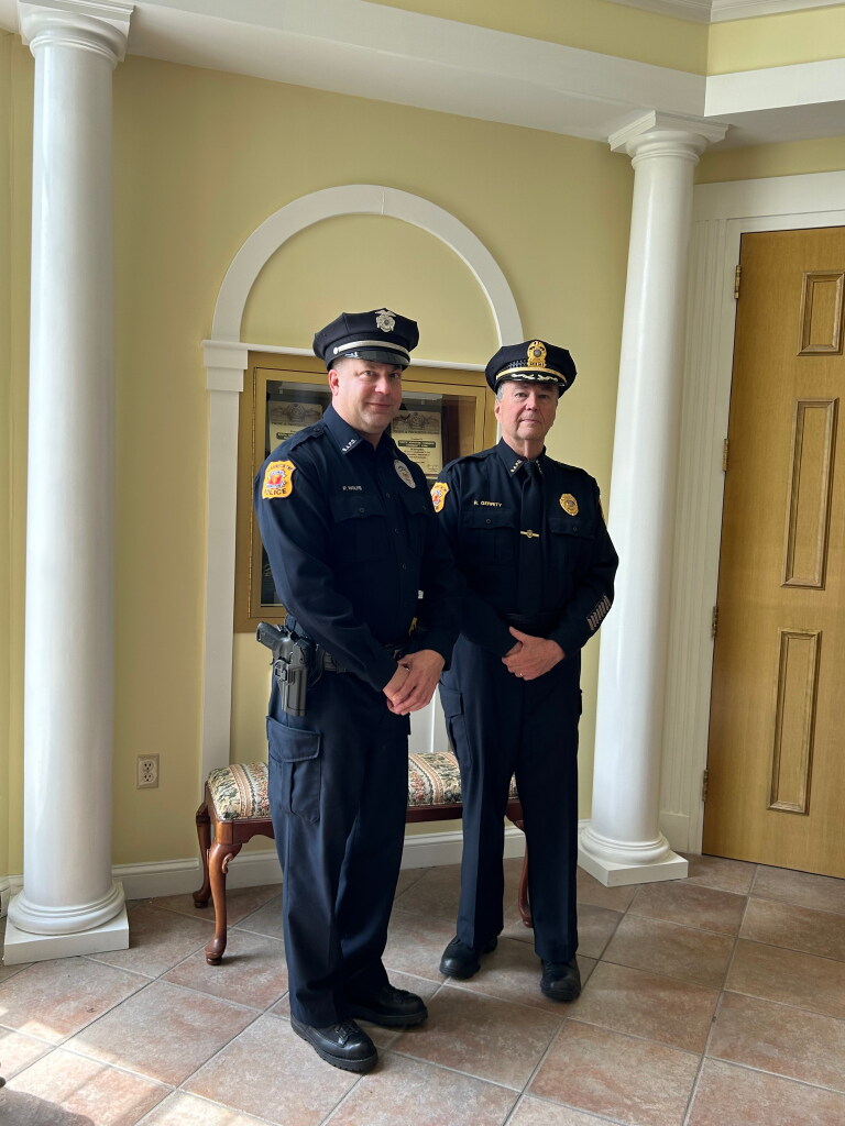 Then-South Abington Twp. Patrolman Paul Wolfe, left, and then-Police Chief...