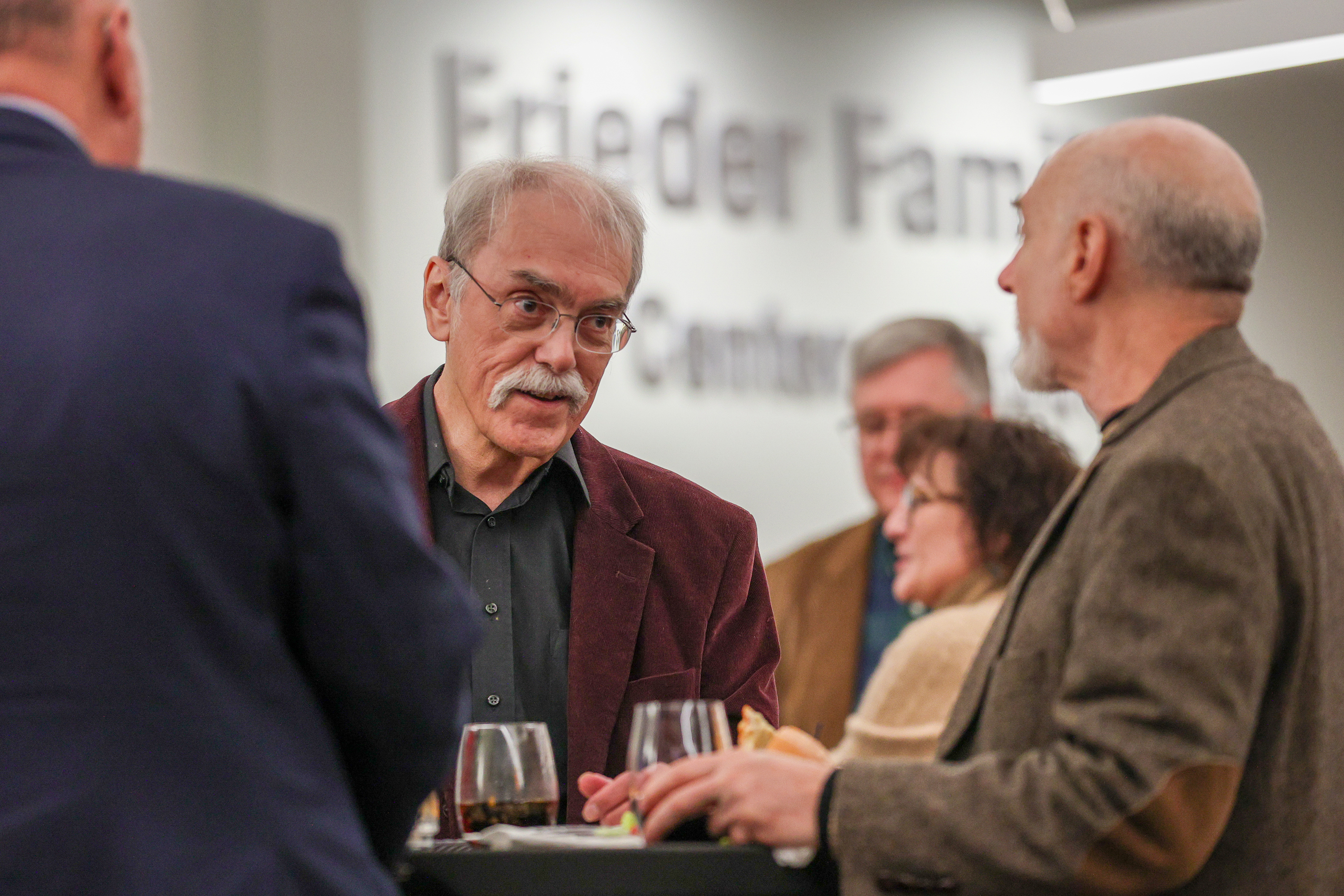 George Graham chats with attendees during his retirement party at...