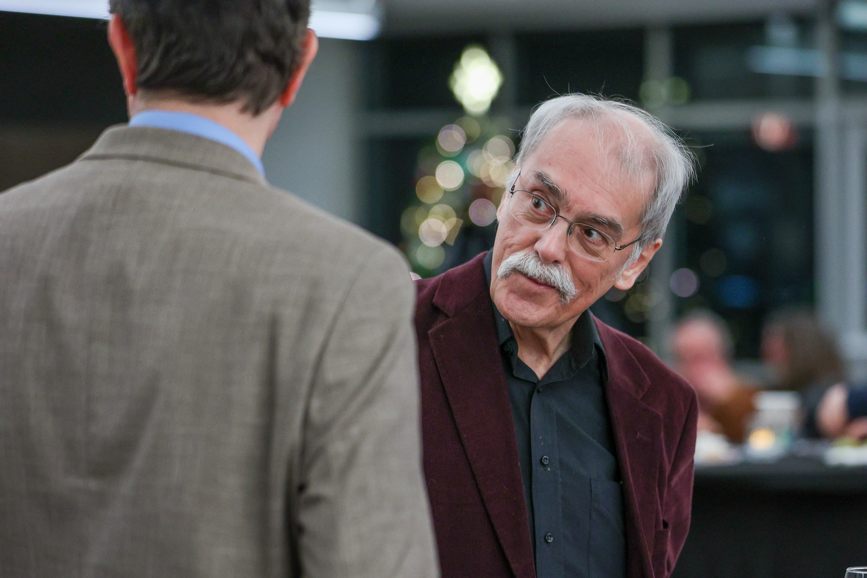George Graham chats with attendees during his retirement party at...