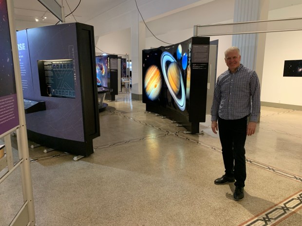 Tim Holmes, CEO of the Everhart Museum in Scranton, stands amid a NASA exhibit at the museum, on Thursday, Jan. 22, 2026. (JIM LOCKWOOD / STAFF PHOTO)