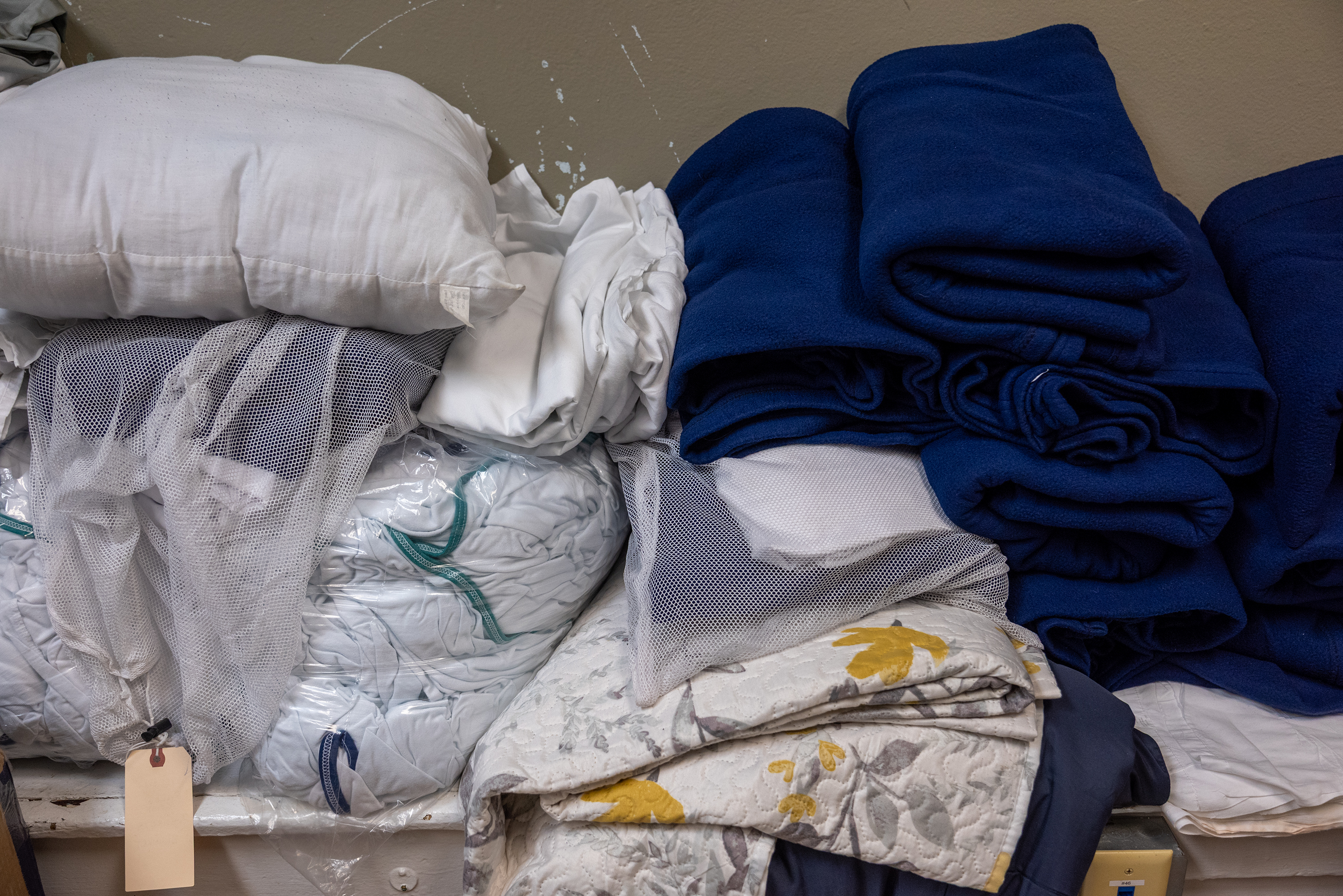 Sheets and bedding in a closet at Weston Field House...