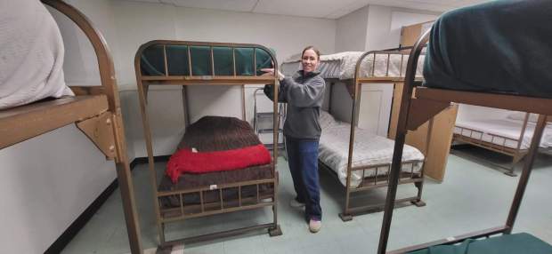 Supervisor of St. James Manor & St. Anthony's Shelter Jessica Spangenberg prepares to welcome people to St. Anthony's Shelter on a recent evening. (GERI GIBBONS/STAFF PHOTO)