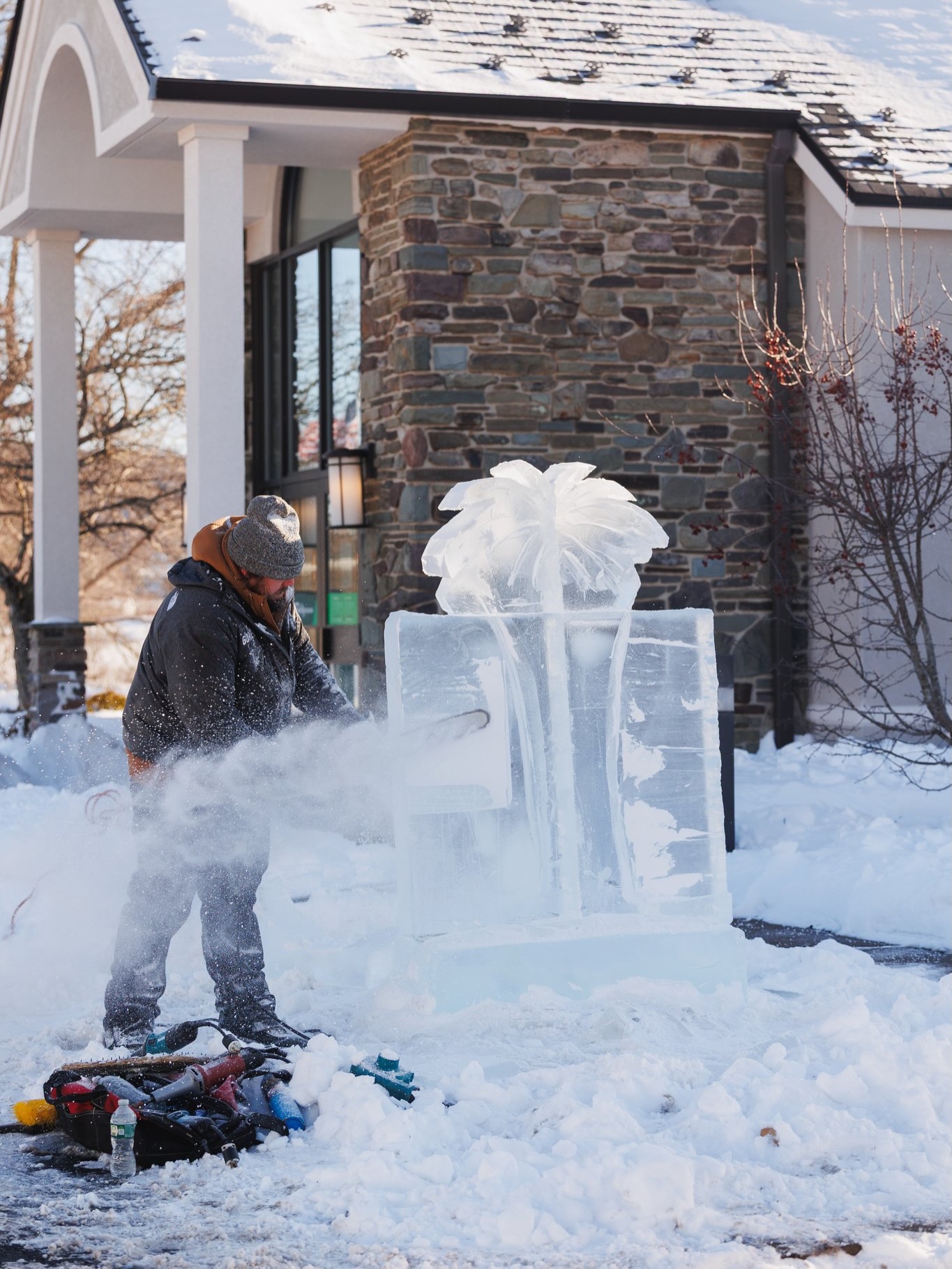 An ice sculptor creates a artwork at Clarks Summit festival...
