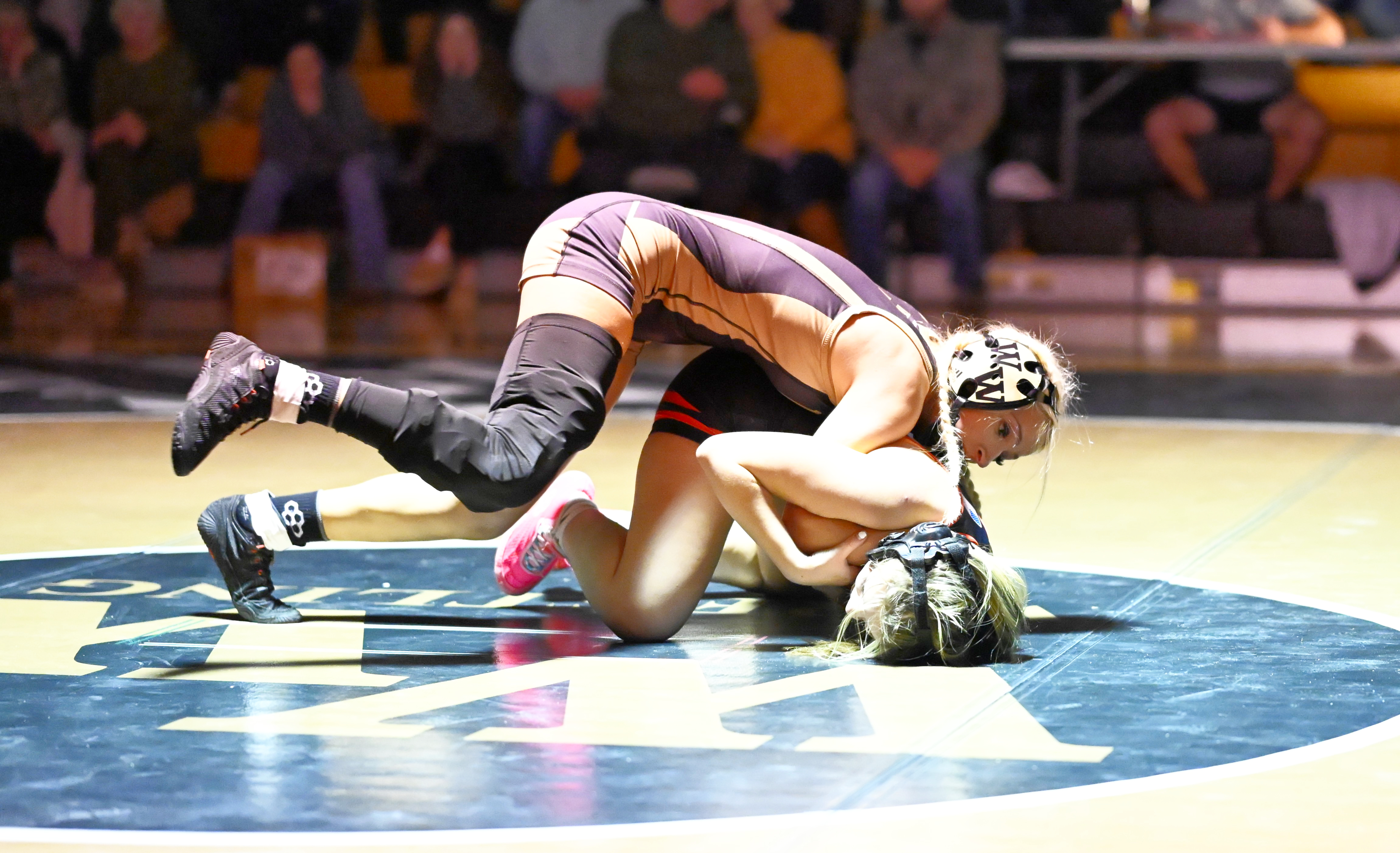Western Wayne’s Mia Gifford, top, wrestles Honesdale’s Alexa Skelton in...