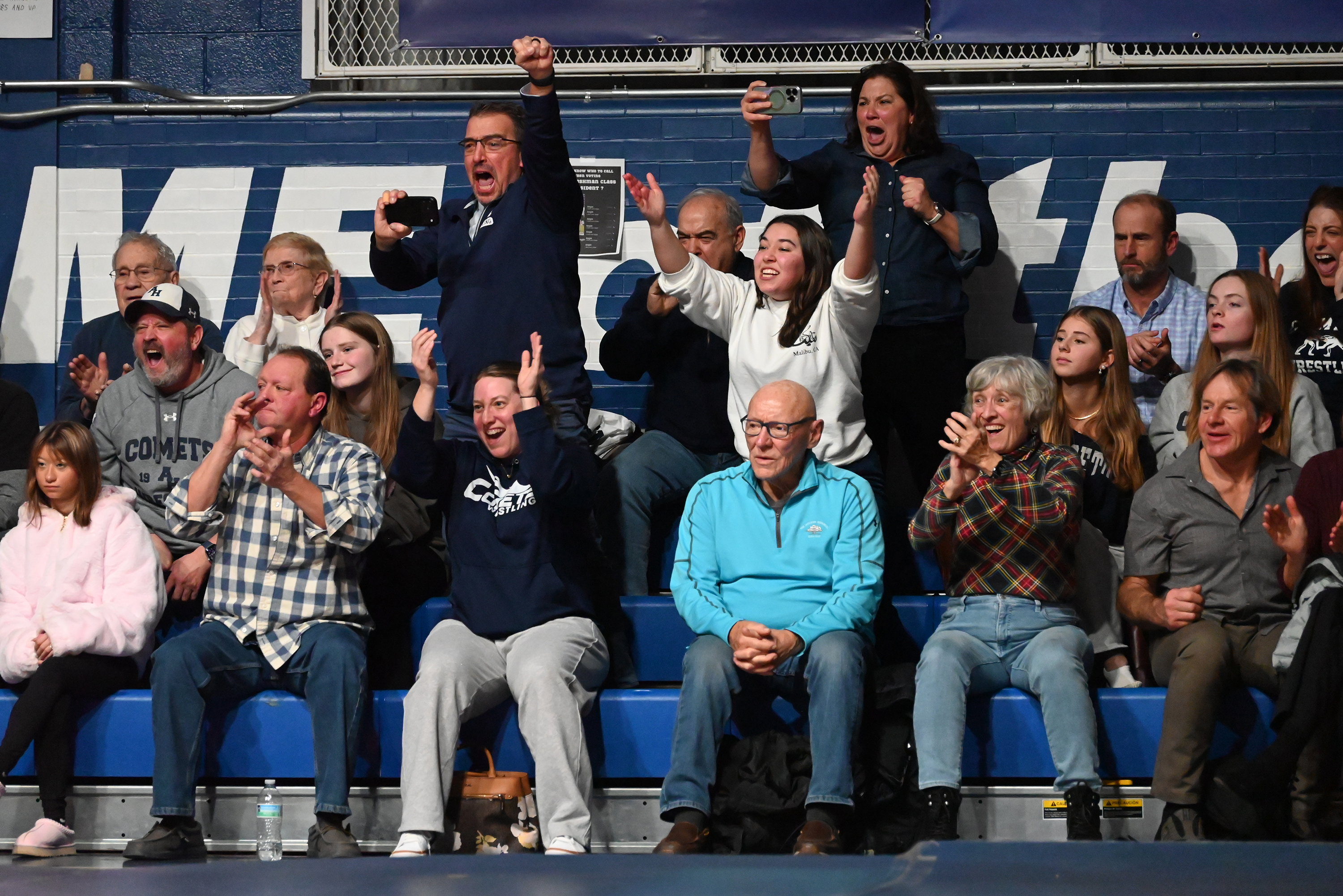 Spectators cheer as Abington Heights’ Braghan Pallis and West Scranton’s...