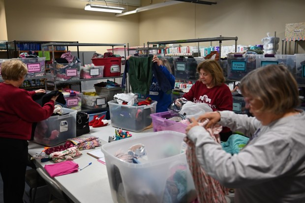 Volunteers organize donations for the children's clothing drive at the St. Joseph Center in Dunmore, Jan. 16, 2026. (REBECCA PARTICKA/STAFF PHOTOGRAPHER)