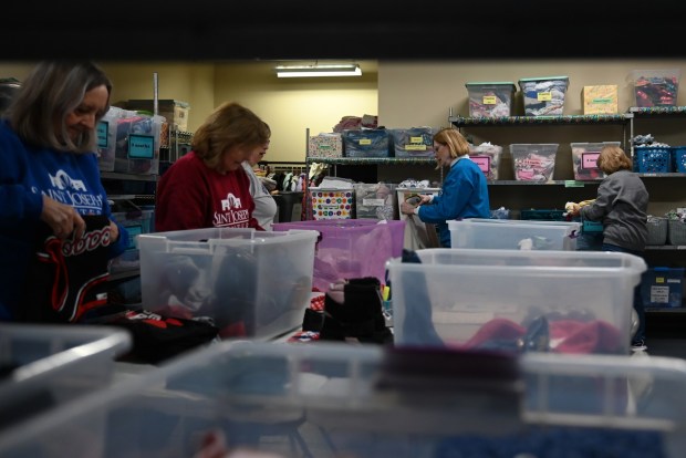 Volunteers organize donations for the children's clothing drive at the St. Joseph Center in Dunmore, Jan. 16, 2026. (REBECCA PARTICKA/STAFF PHOTOGRAPHER)
