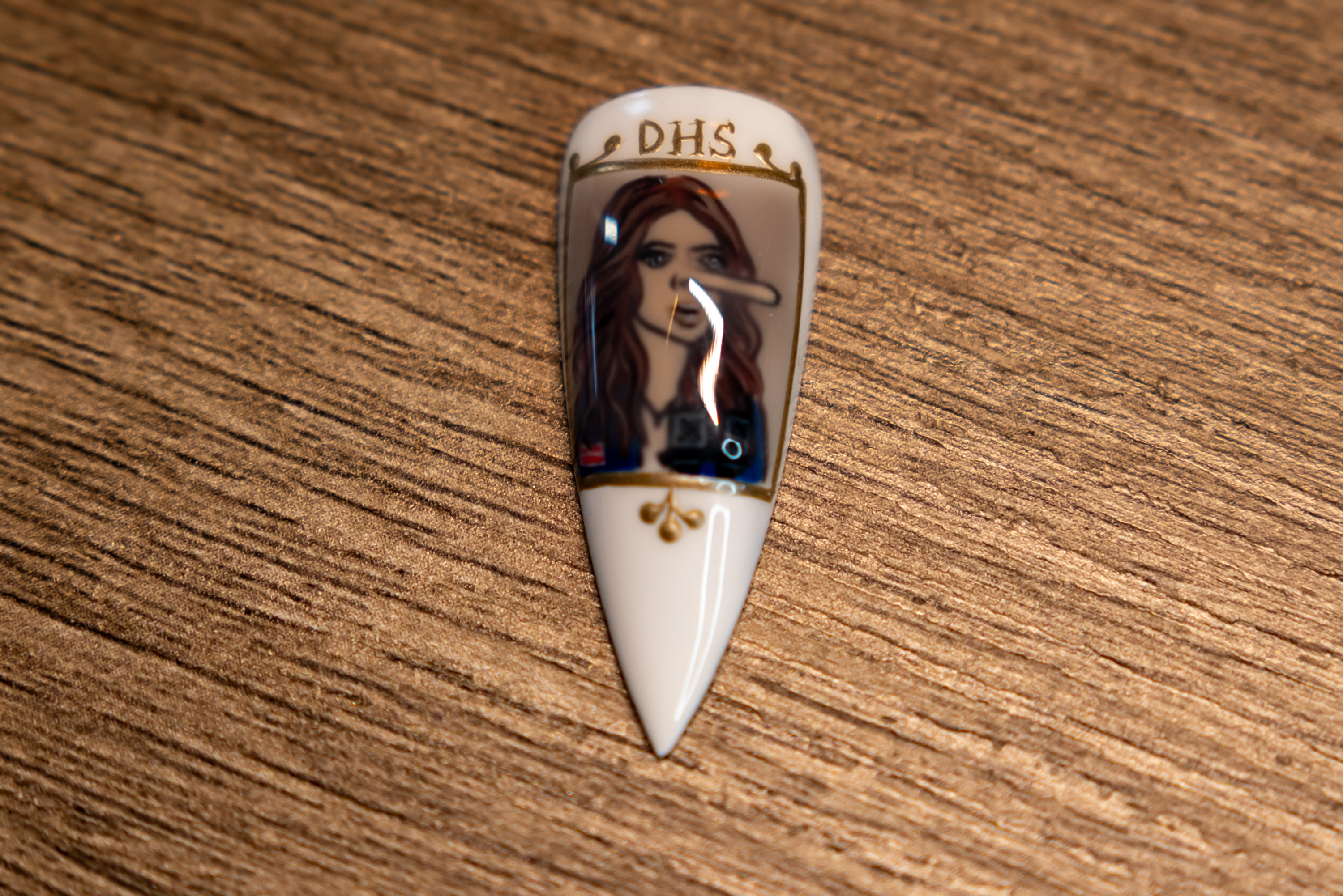 A close up of one of the nails in artist...