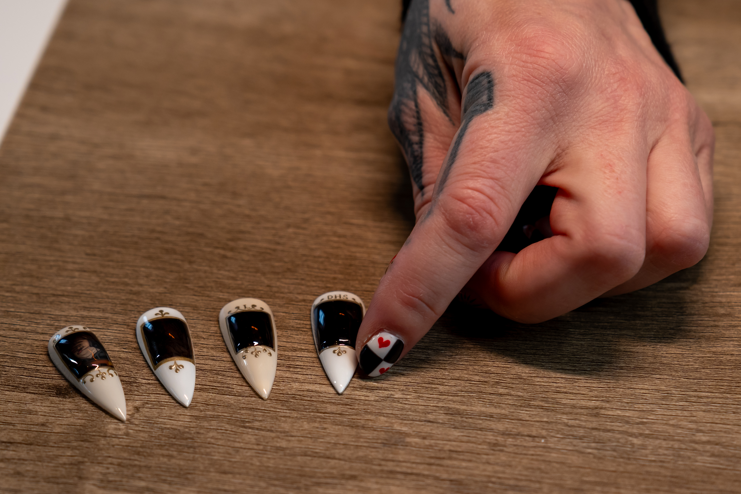 Artist Heather Buzzell shows the anti-ICE nail set before heat...