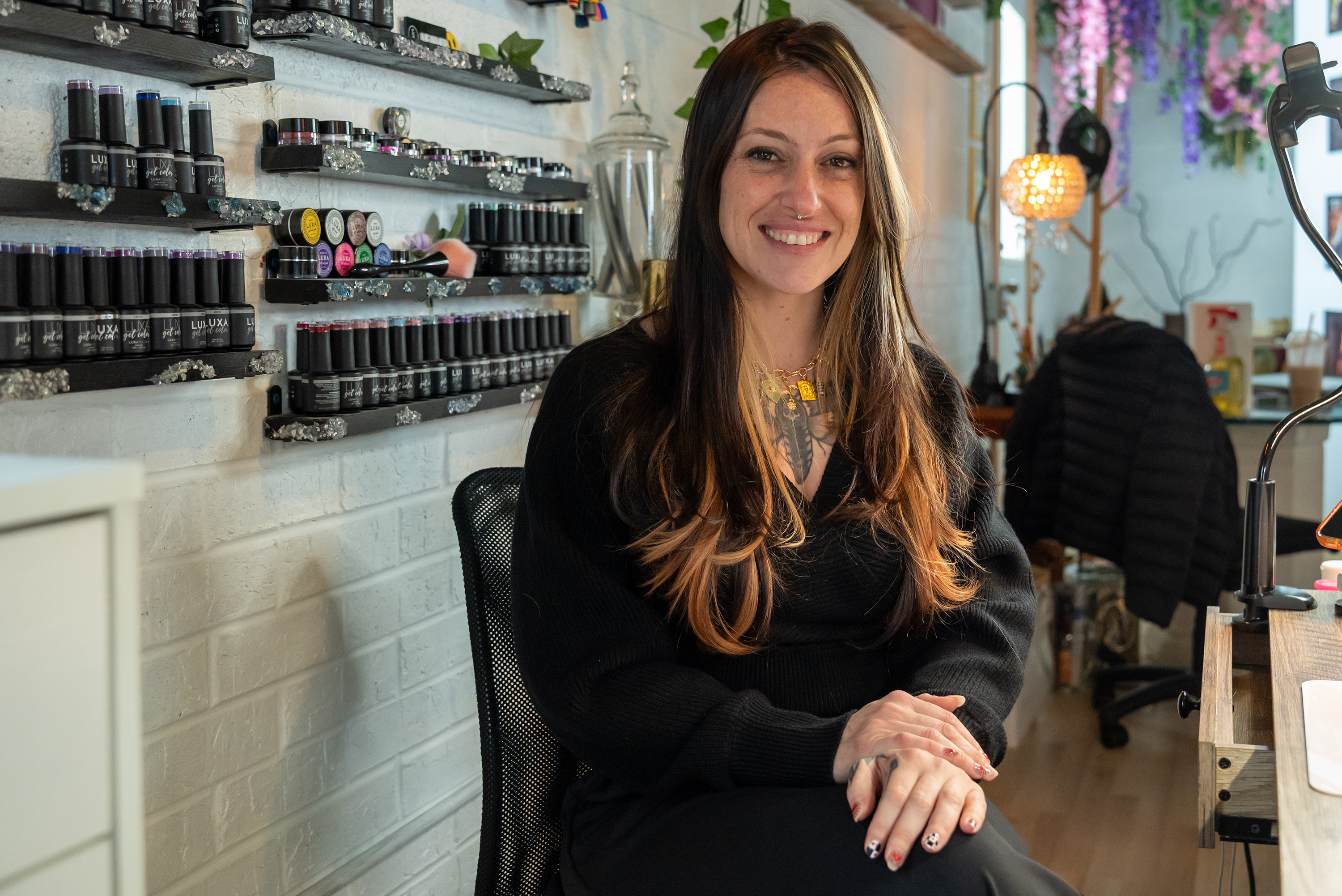Nail artist Heather Buzzell in her workspace in Tunkhannock on...
