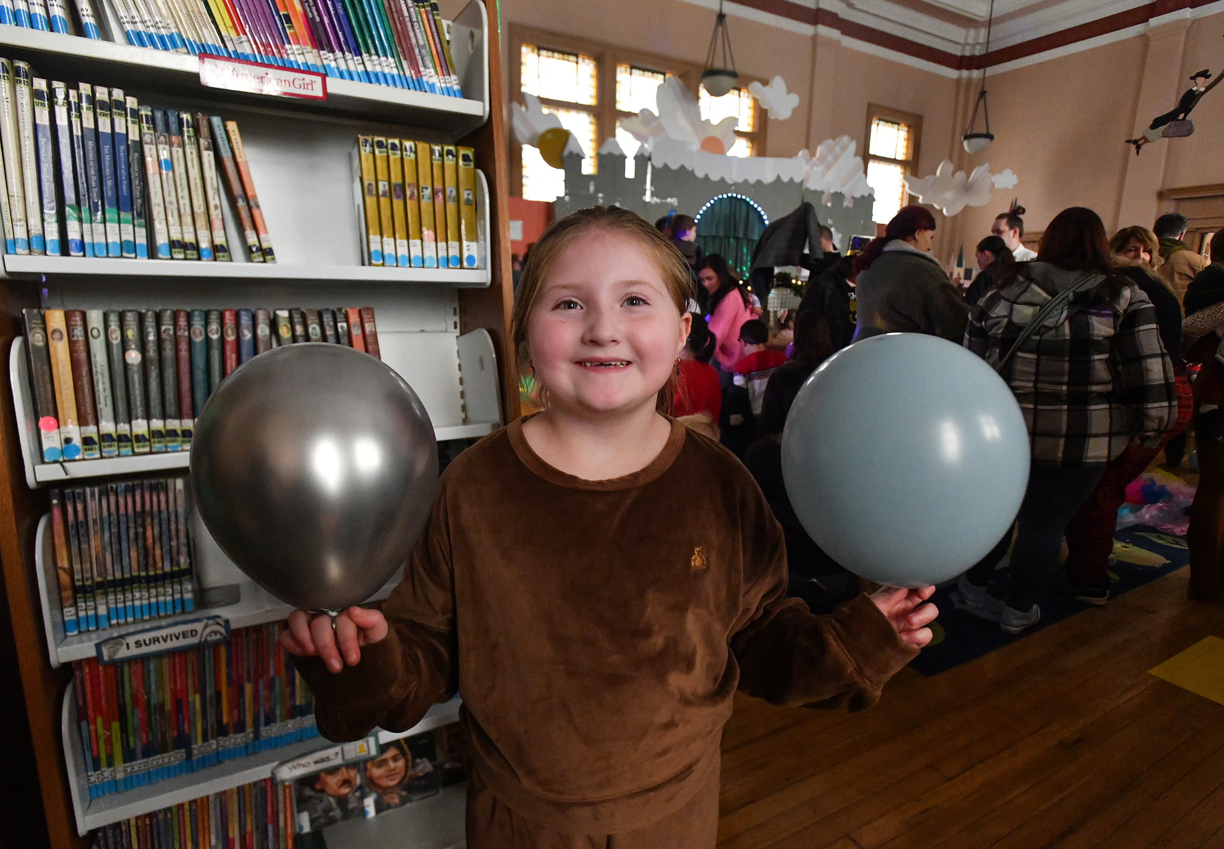 Bella Russell, 7, of Throop attends the Noon Year's Eve...