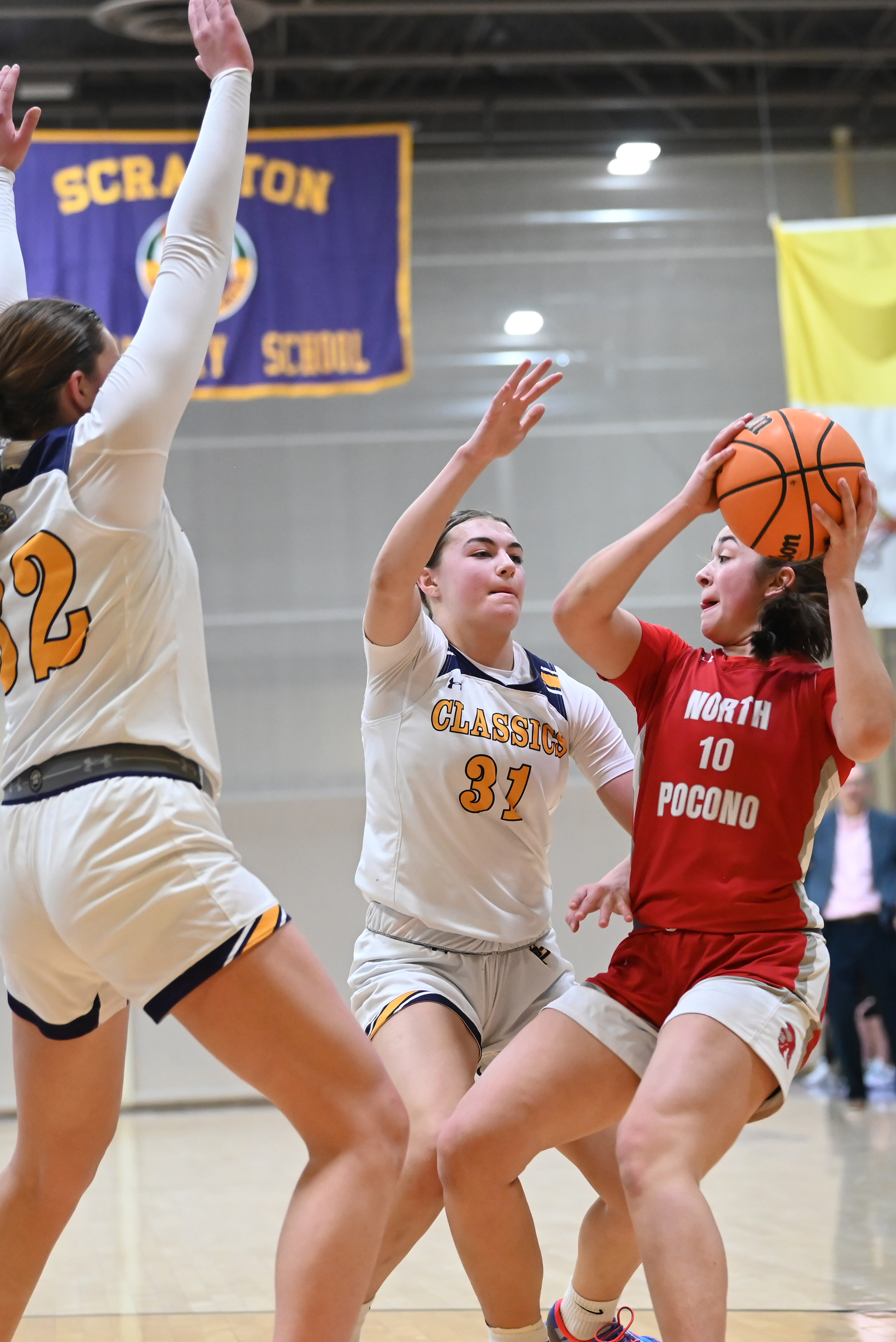 Scranton Prep’s Chloe Mamera (32) and Eva Kaszuba (31) defend...