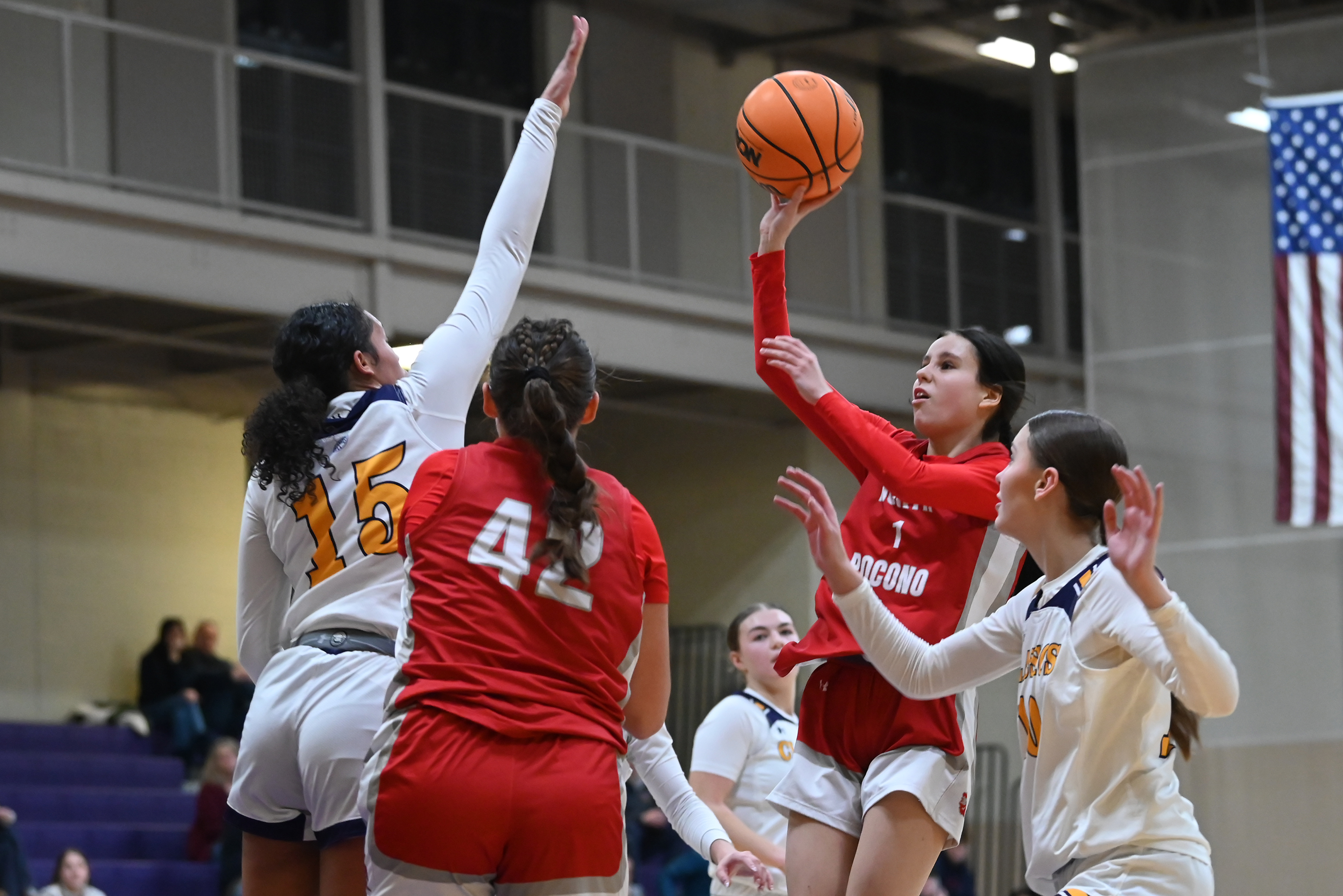 North Pocono’s Trinity Litts shoots and scores over Scranton Prep’s...