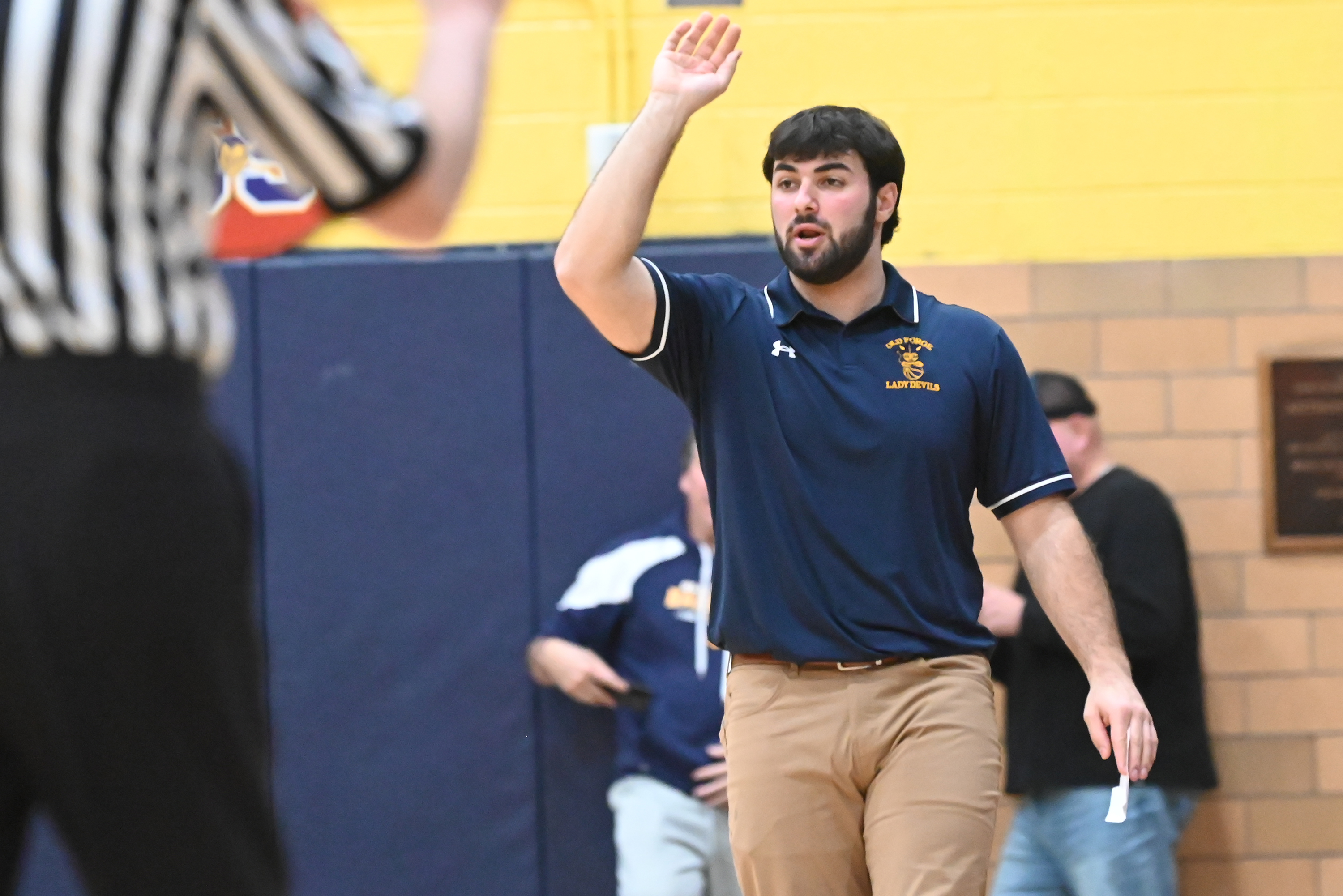 Old Forge’s head coach Dante Lucarelli calls out to his...