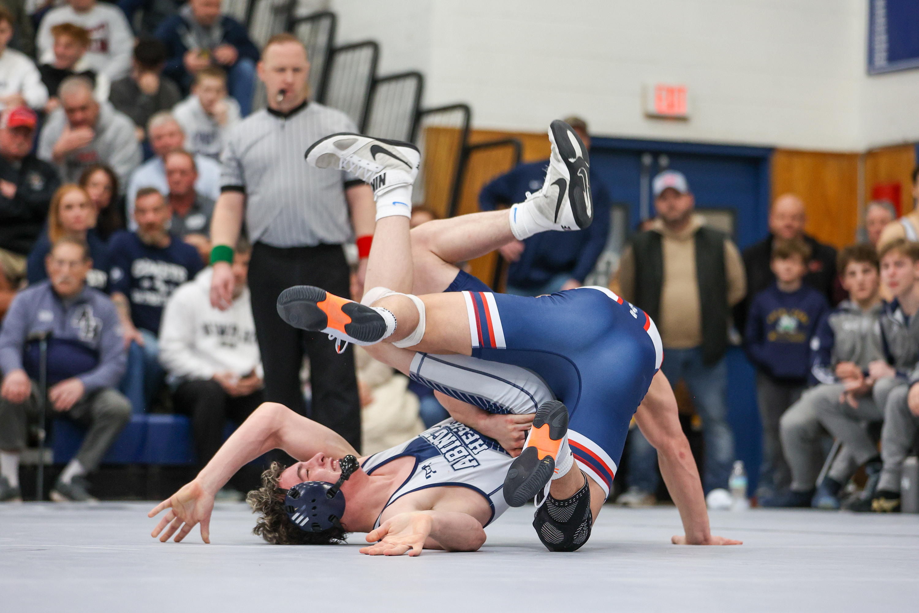 Pittston Area’s Ethan Aftewicz and Abington Heights’ Lucas Drake tumble...