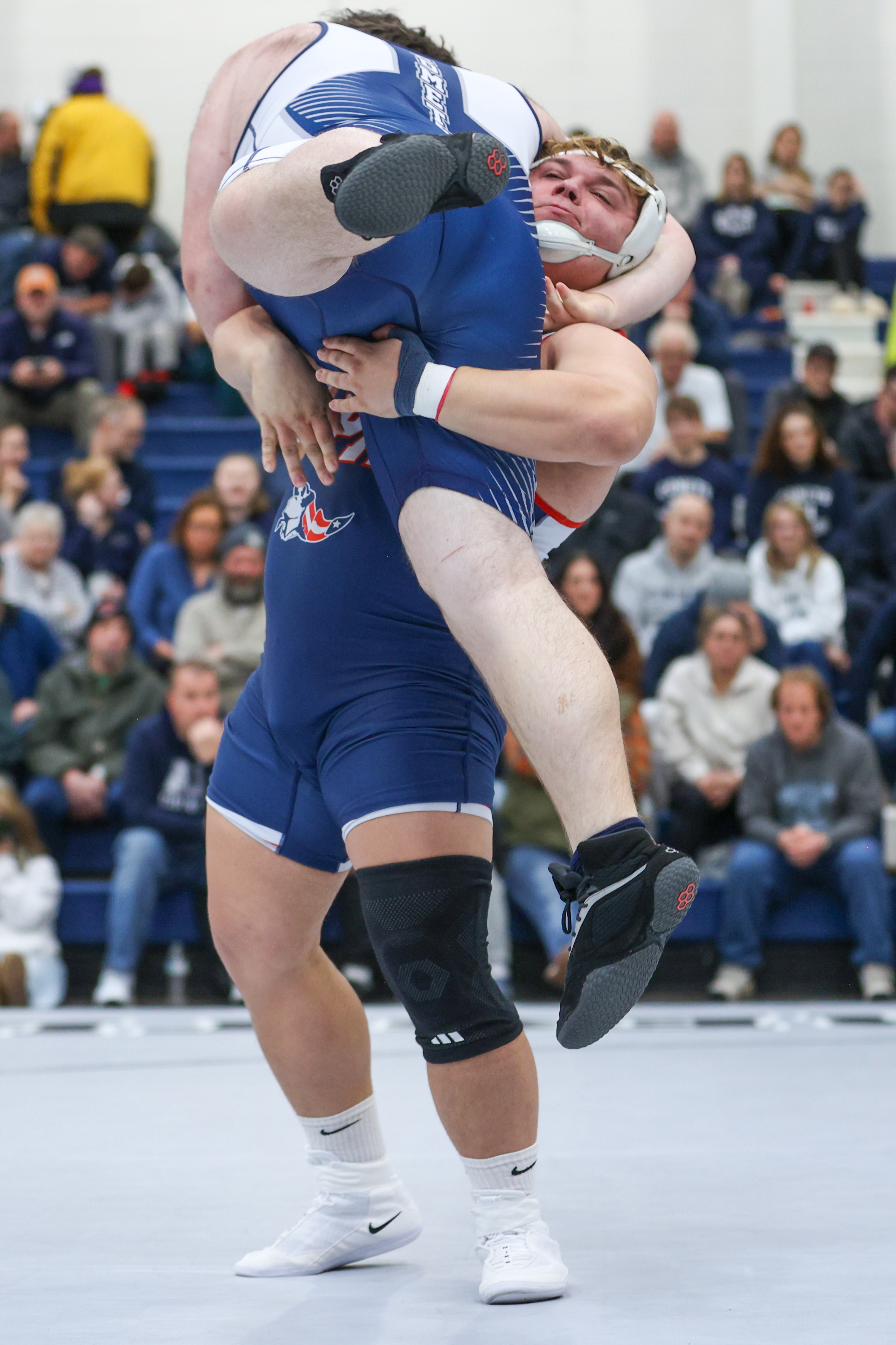Pittston Area’s Noah Gruber picks up Abington Heights’ Dane Wheeler...