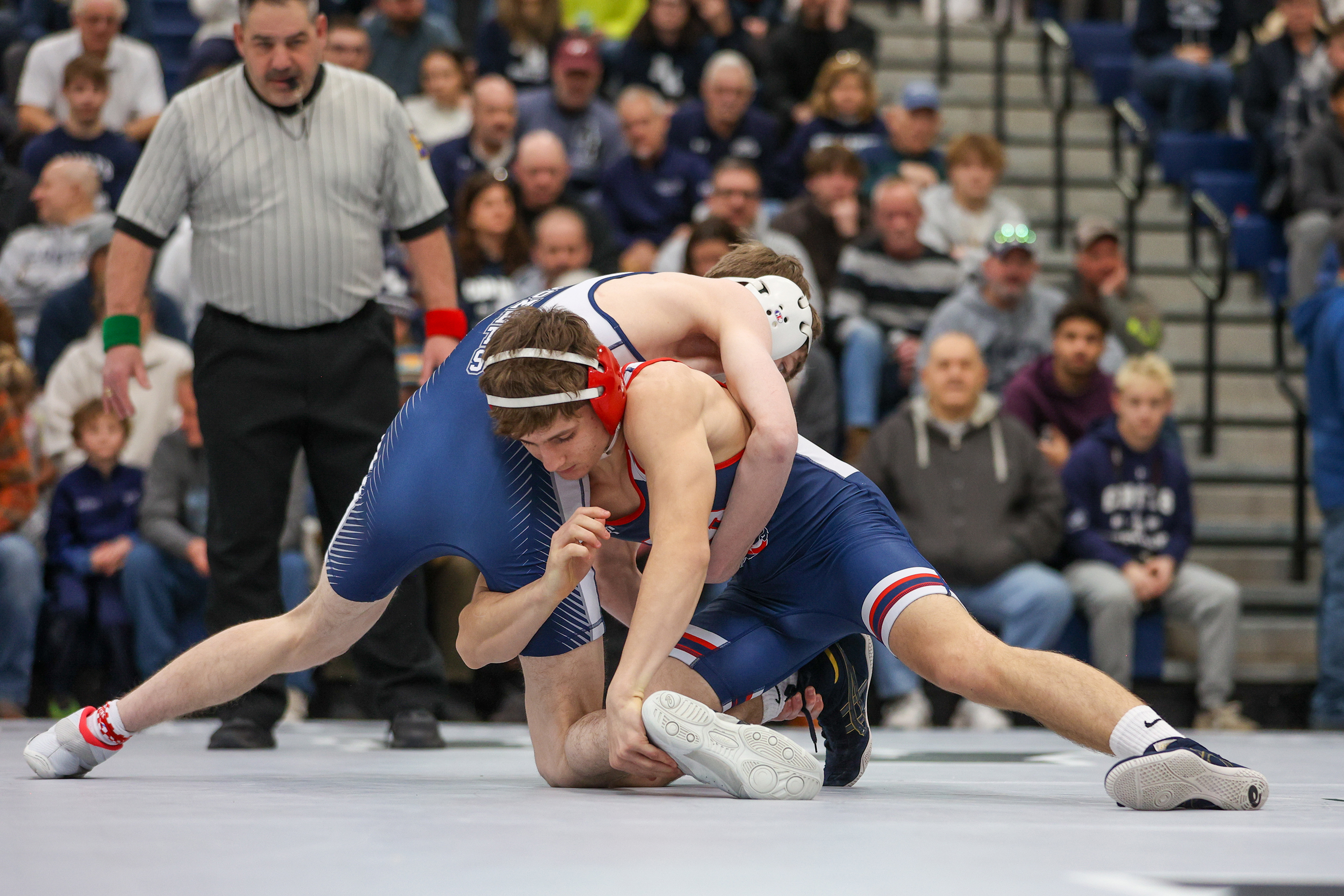 Pittston Area’s David Krantz, left, lunges into Abington Heights’ Lucas...