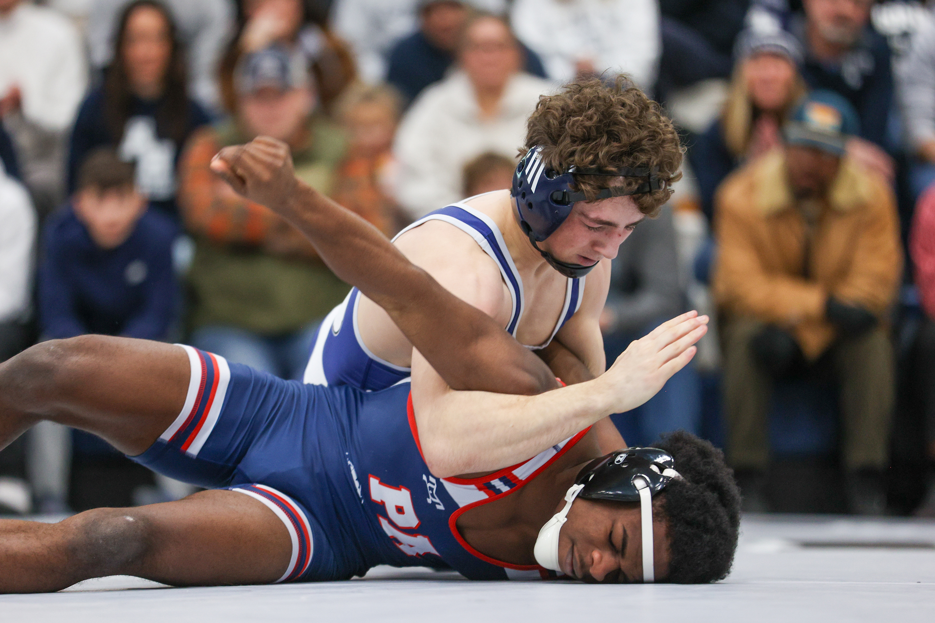 Abington Heights’ Mason Whitney holds Pittston Area’s Jaheim Butler’s arm...