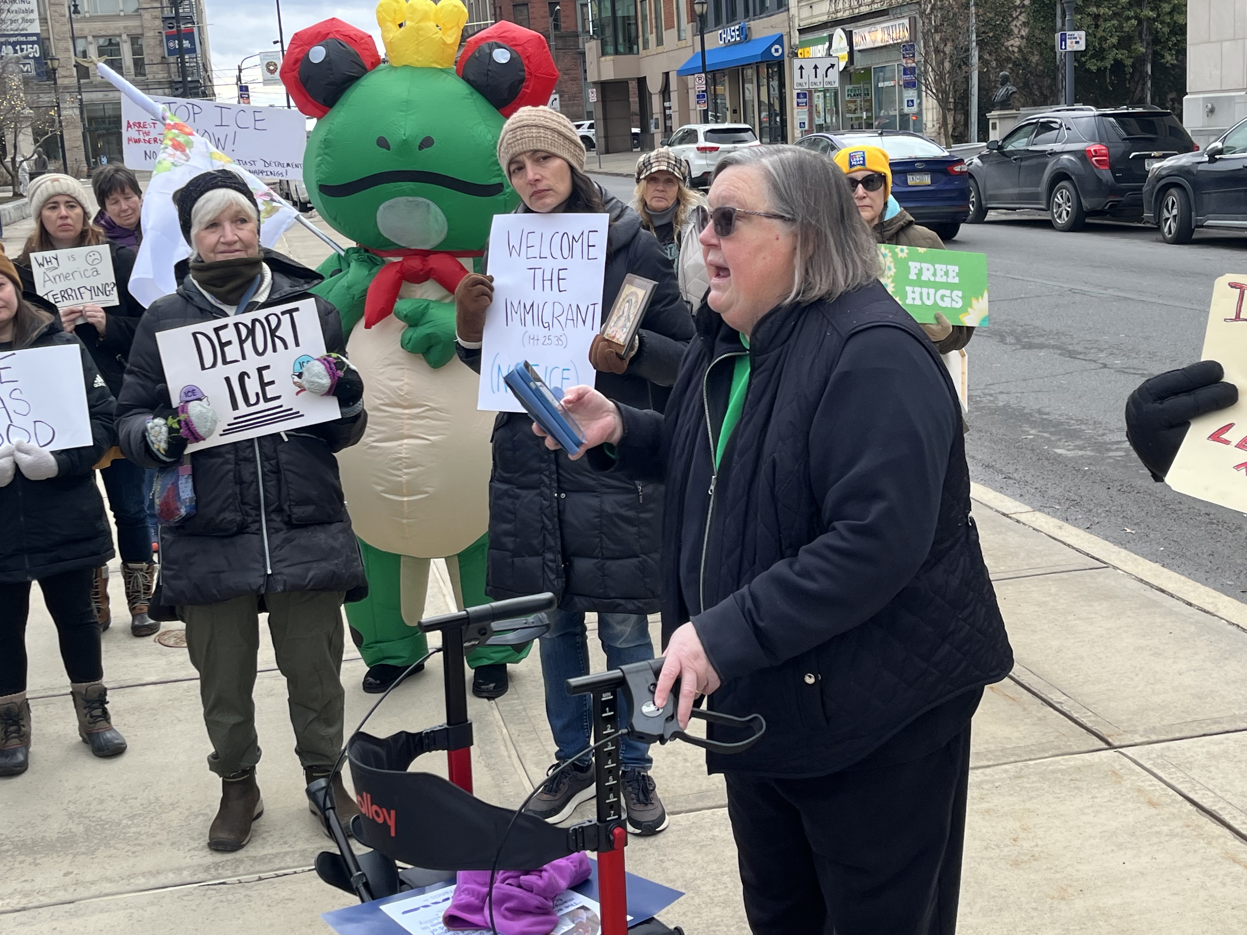 Sister Suzie Armbruster recites a prayer Sunday afternoon during a...
