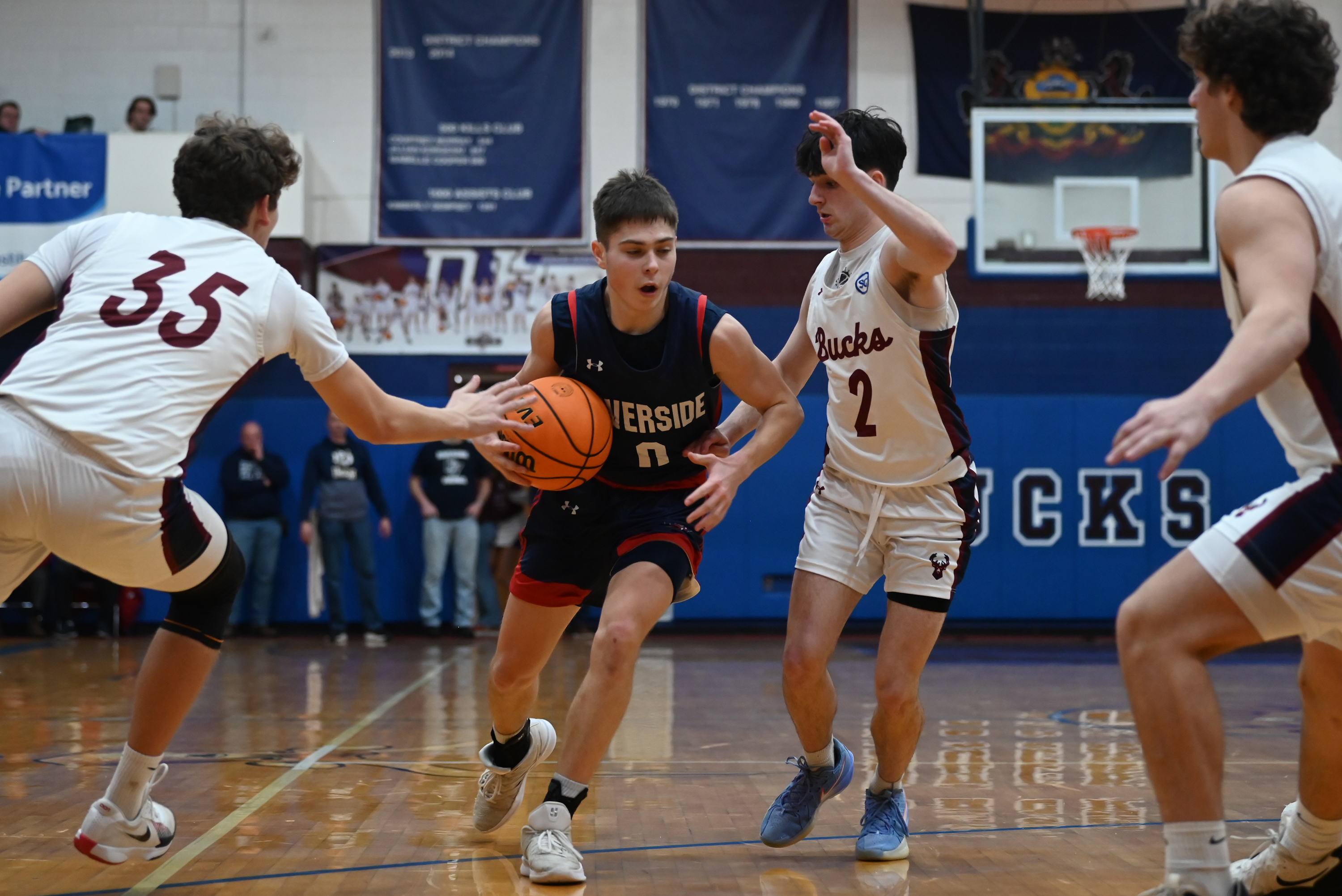 Dunmore’s Luke Franek (35) and Carter Coyle (2) defend Riverside’s...