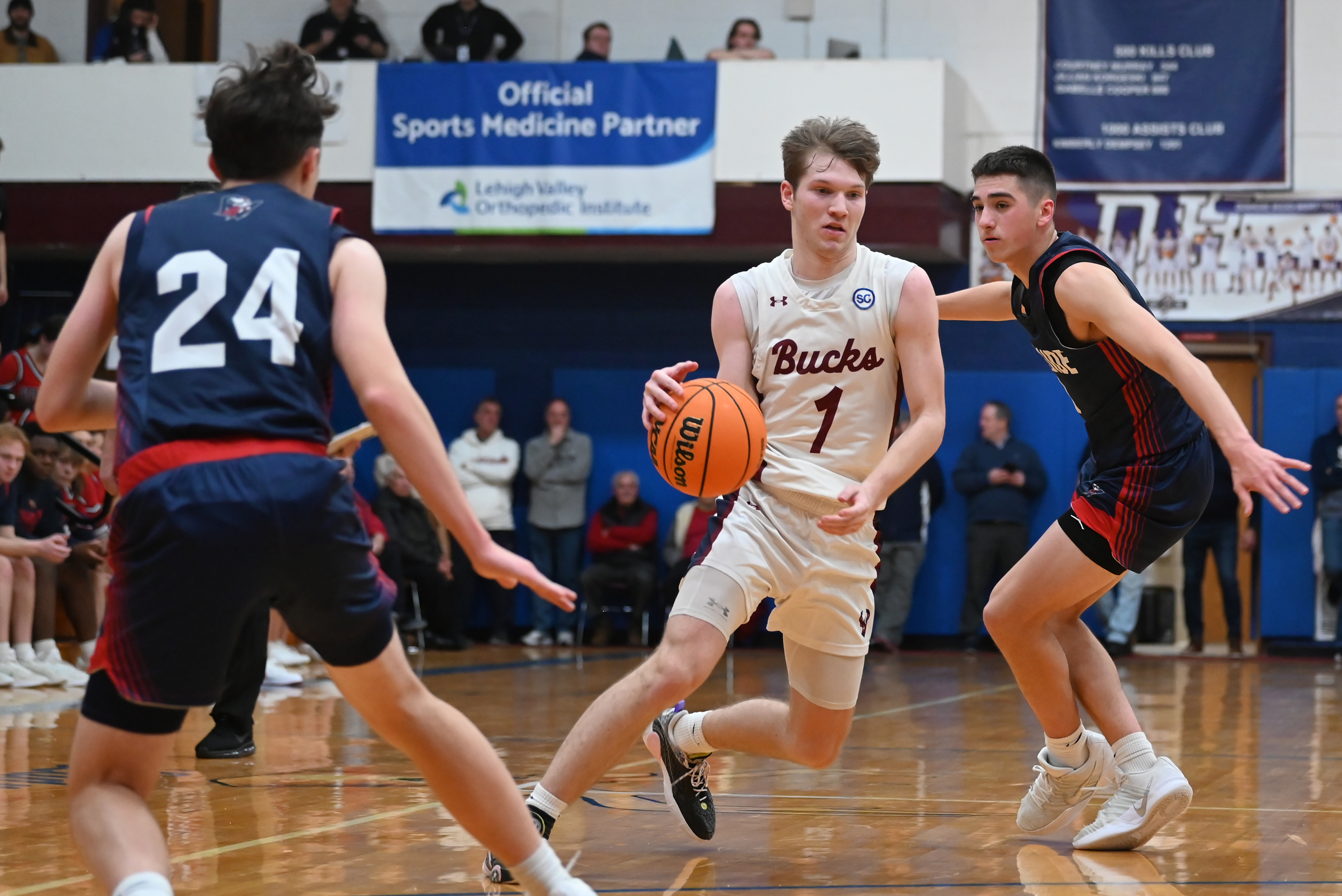 Dunmore’s Brayden Canavan drives between two Riverside defenders during the...