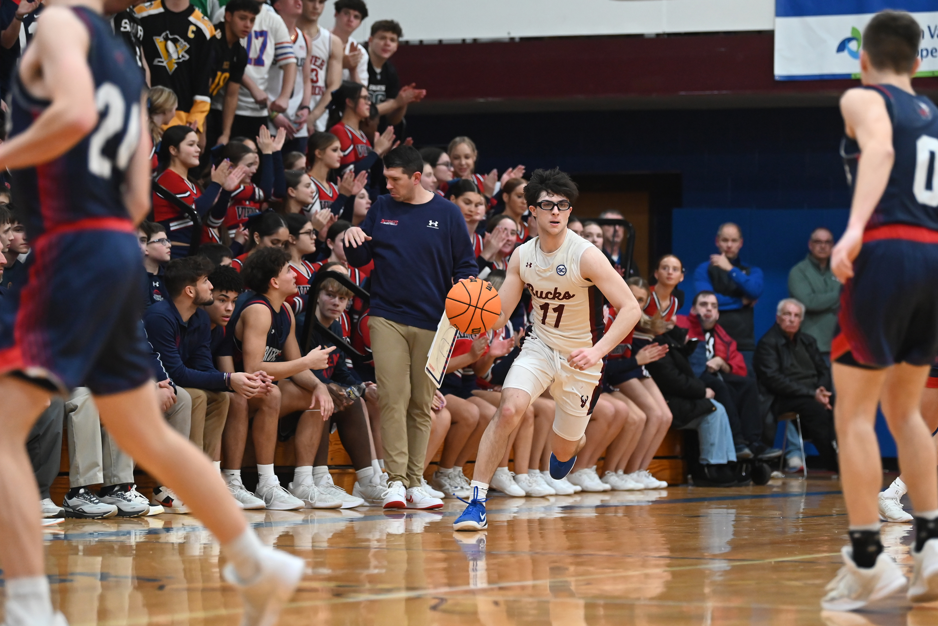Dunmore’s Nate Aviles brings the ball up the court during...