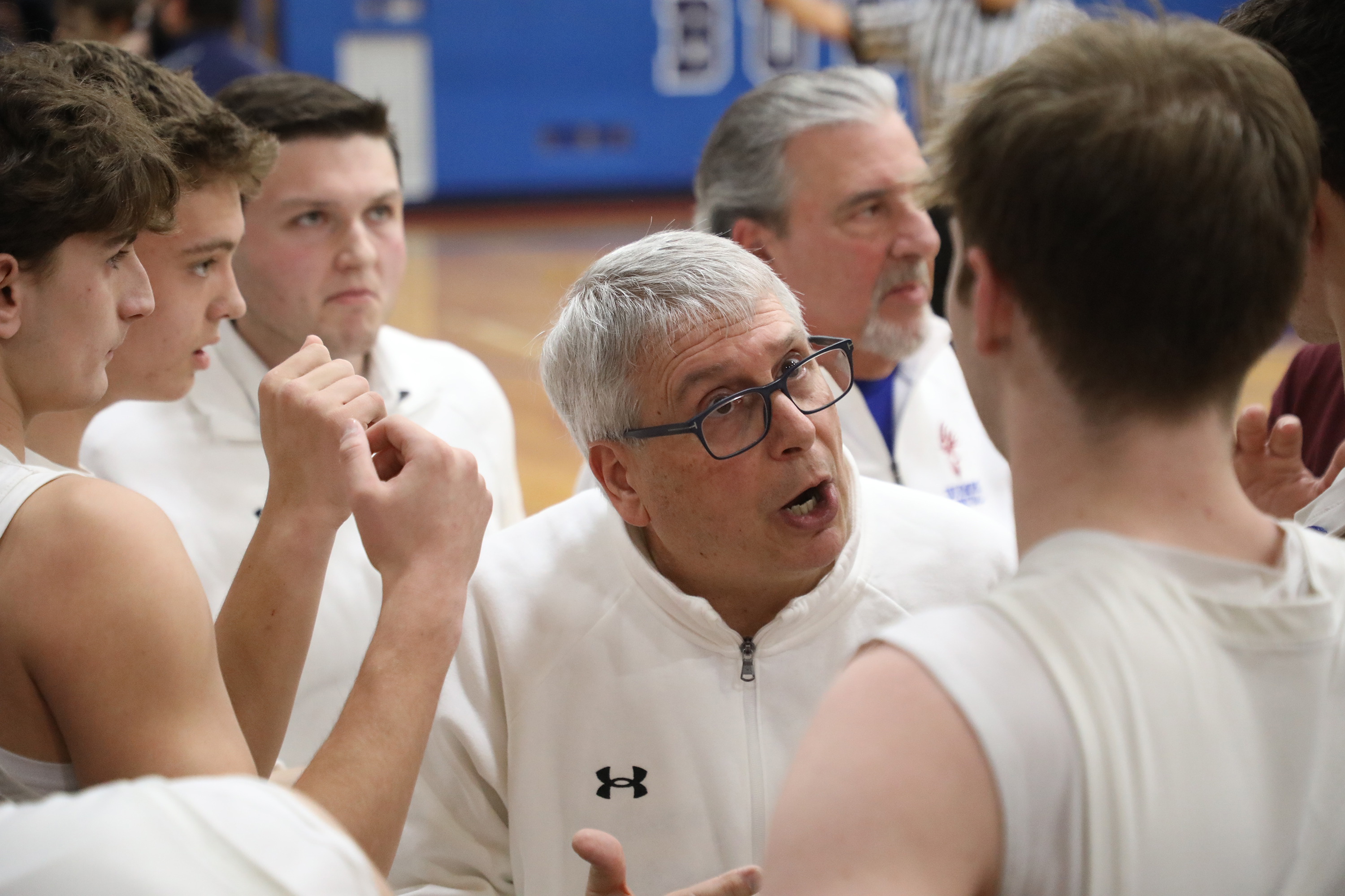 Dunmore’s head coach Mark Finan talks to his players during...
