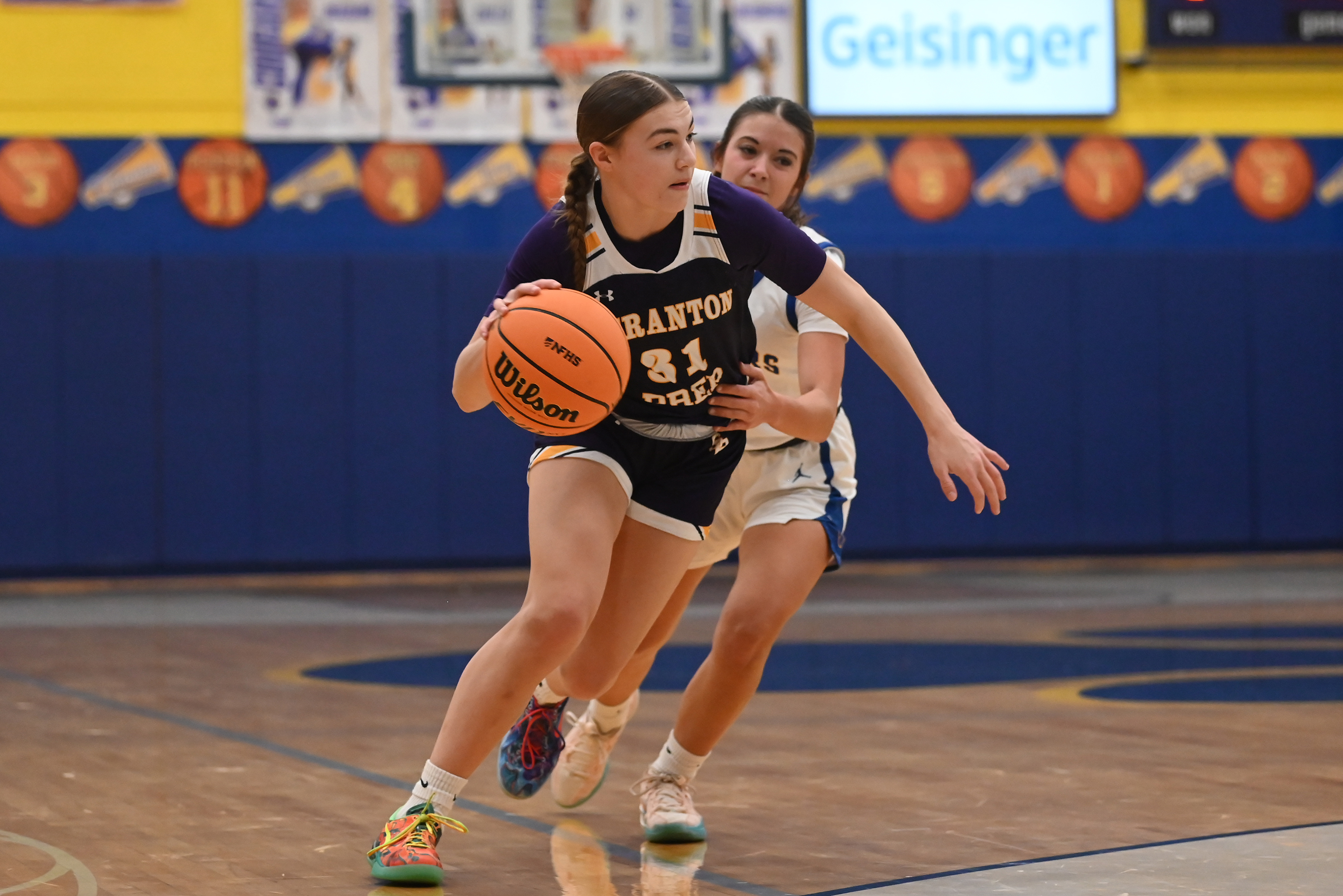 Scranton Prep’s Eva Kaszuba moves the ball during the basketball...