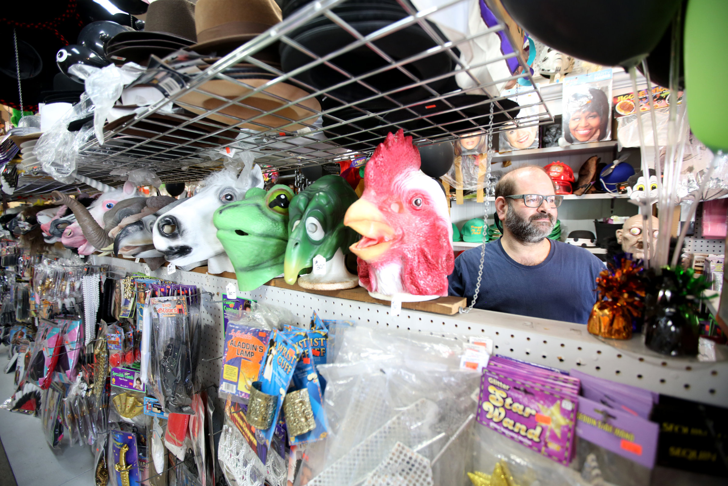 Former Taney’s Costume Shop owner Craig Friedman stands among the...