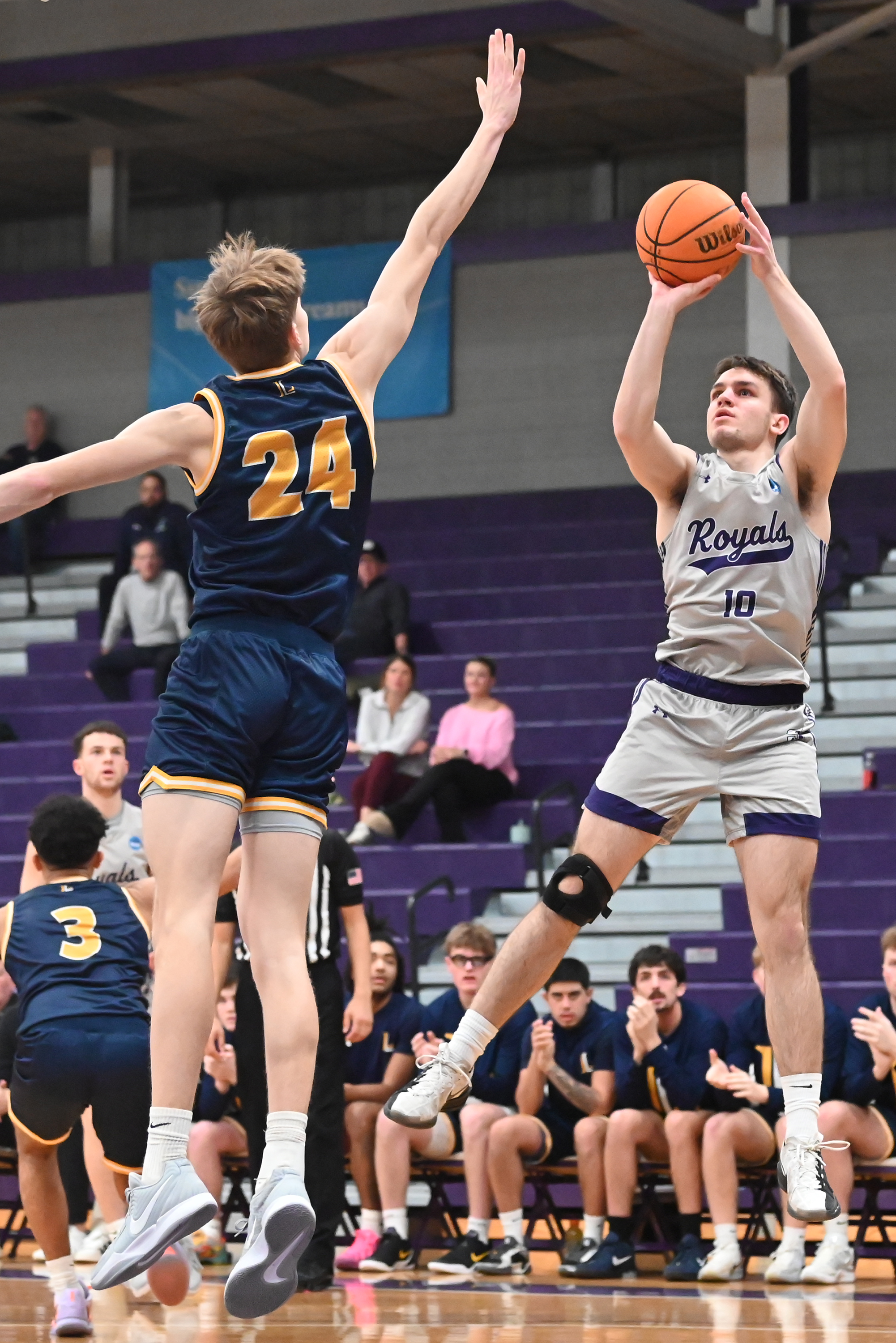 Lycoming College’s Hayden Pardoe defends the University of Scranton’s Ben...