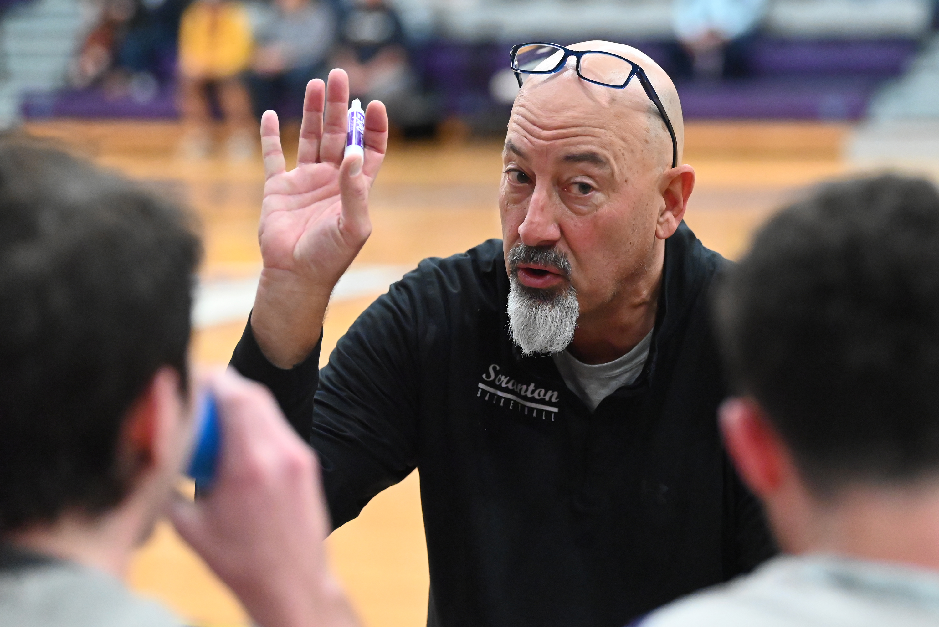 University of Scranton’s head coach Carl Danzig talks to his...