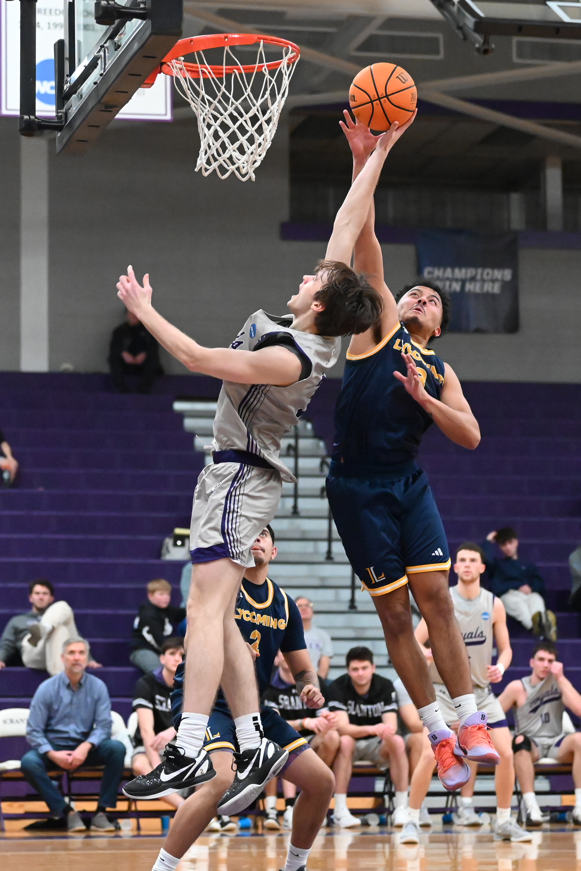 Lycoming College’s Isaiah Valentine defends University of Scranton’s Sammy Tornabene...