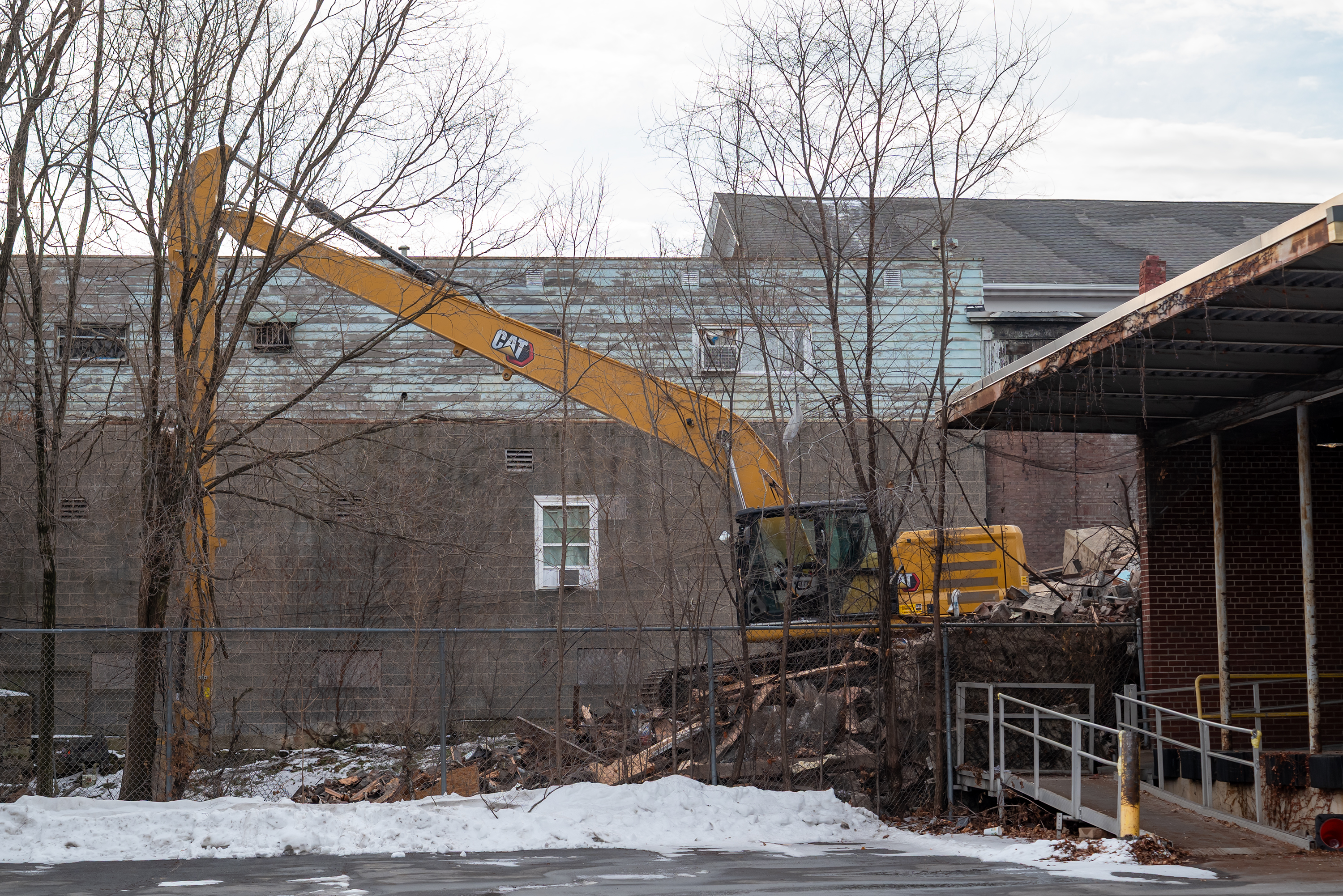 Crews work on razing a portion of the West Scranton...