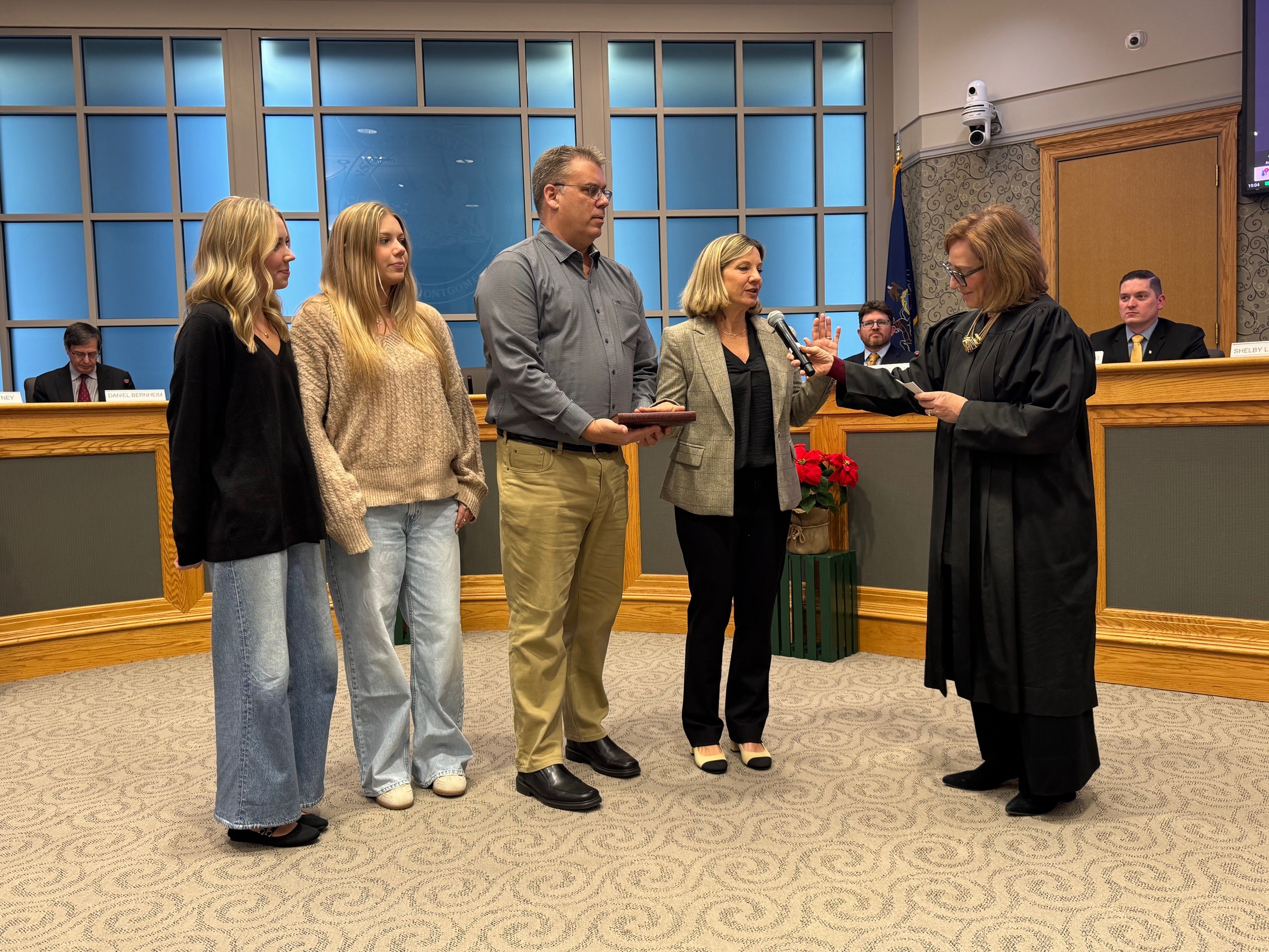 Shelby Sparrow being sworn in as Commissioner in Ward 14...