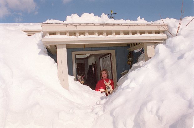 Dianne Duford stands in the front door of her Weisenberg Township home with 'Christopher', her pet chihuahua, Jan. 10, 1996. (Tom Volk/The Morning Call)