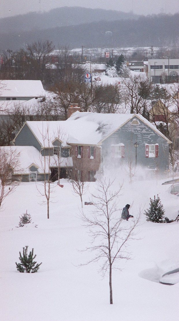 A resident of Salisbury Township gets an early start shoveling after the blizzard of 1996. The view includes Lehigh Street and South Mountain. (Naomi Halperin/The Morning Call)