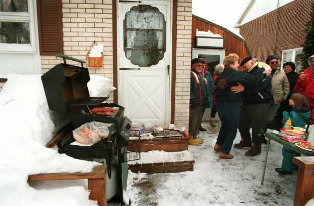 Jean Kosalko polkas with neighbor Jerry Rodriguez during a bar-b-que at Kosalko's house in Hellertown. 15-20 neighbors had gotten together to shovel the alley behind their homes Jan. 9, 1996. (Dan DeLong/The Morning Call)