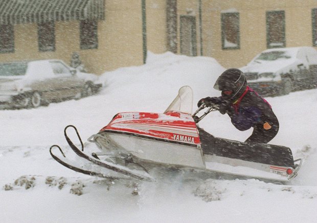 Cyndi Rice, a die-hard Eagles fan, did not let a little snow stop her from going to Rookies sports bar to watch the Eagles-Dallas game as she came via snowmobile Jan. 7, 1996, during the blizzard of 1996. (John C. Anderson/The Morning Call)