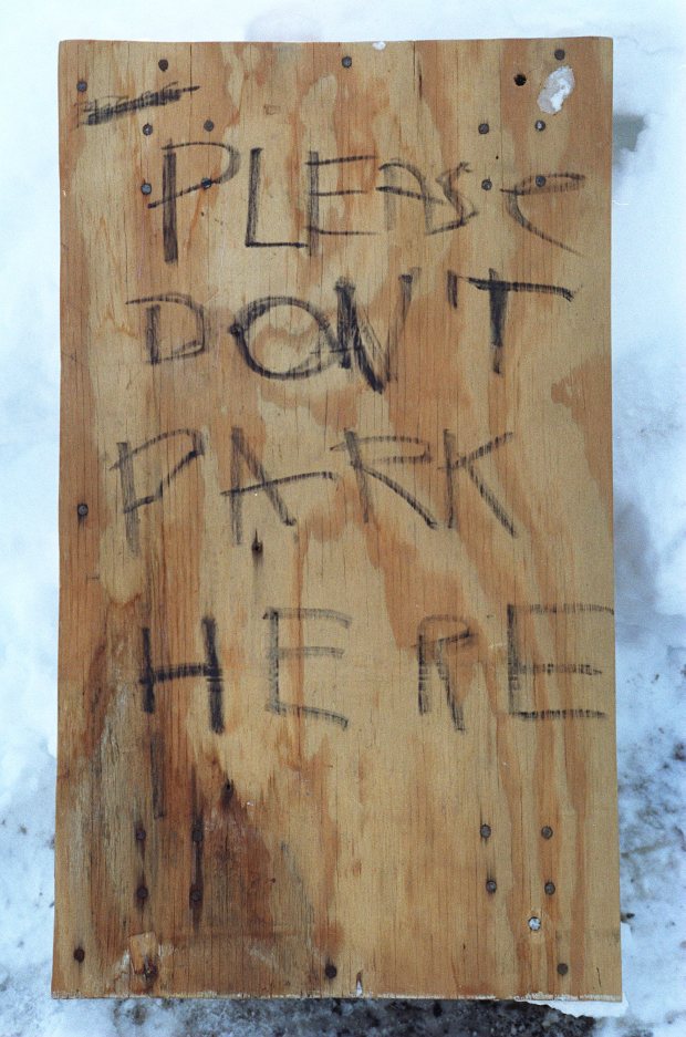 A sign that asks motorists, "Don't Park Here" was placed in the 1600 block of Elm Street in Allentown, as residents continued to dig out from the blizzard of 1996, Jan. 11, 1996. (Harry Fisher/The Morning Call)