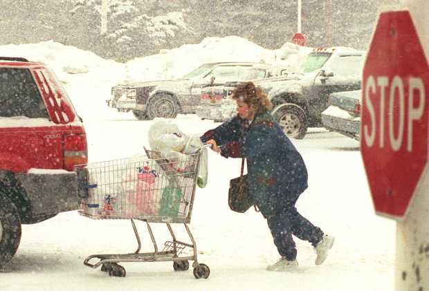 A shopper braves the blizzard of 1996 to shop for food midday Sunday, Jan. 7, at Kings supermarket at the Westgate Mall in Bethlehem. (Morning Call file photo)